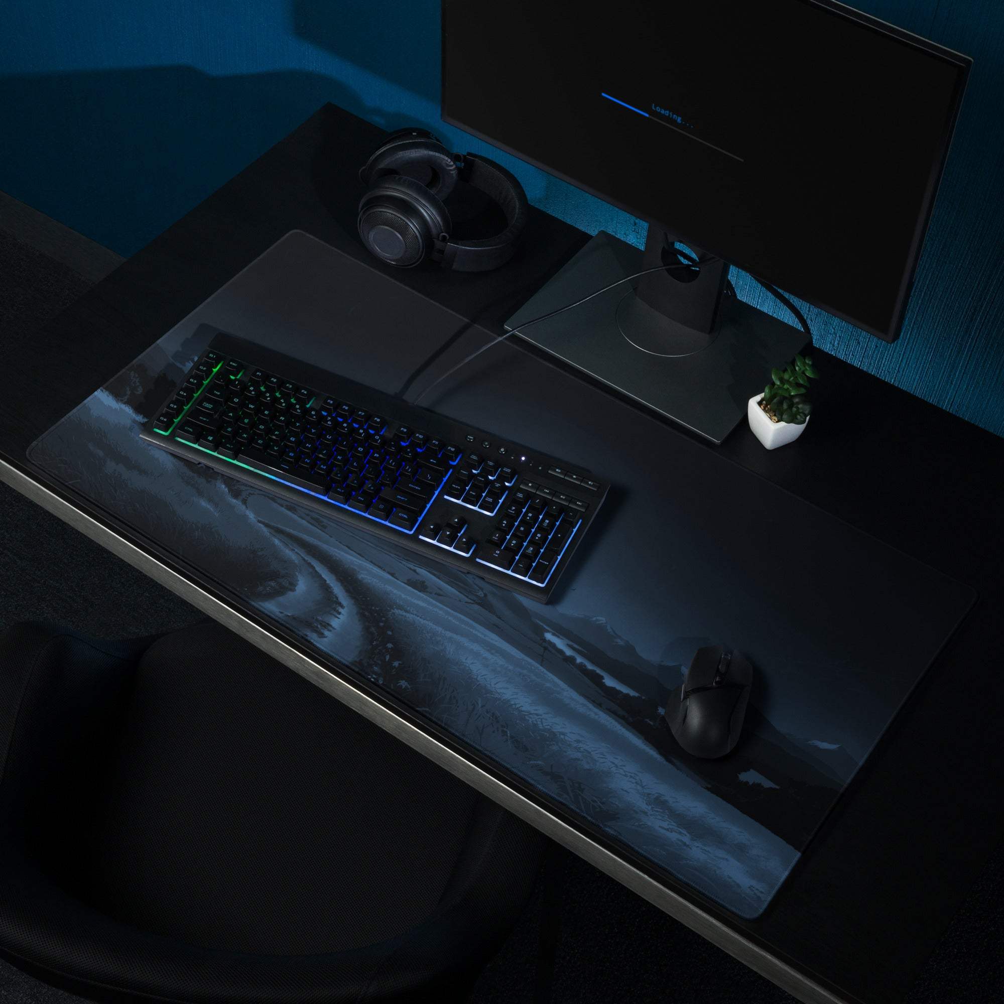 Black cosmic nebula gaming mouse pad with swirling blues and purples