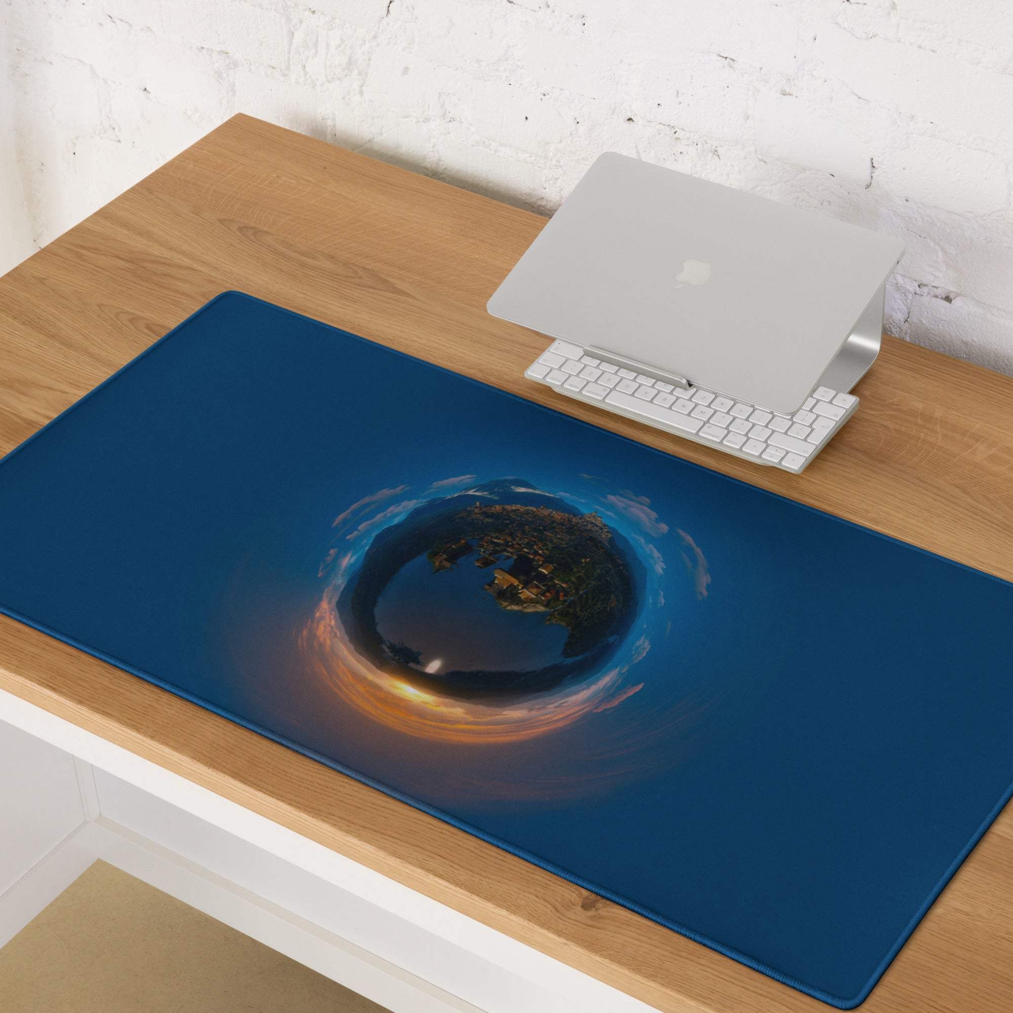 Blue cosmic earth gaming mouse pad with orange gold swirls, deep ocean large