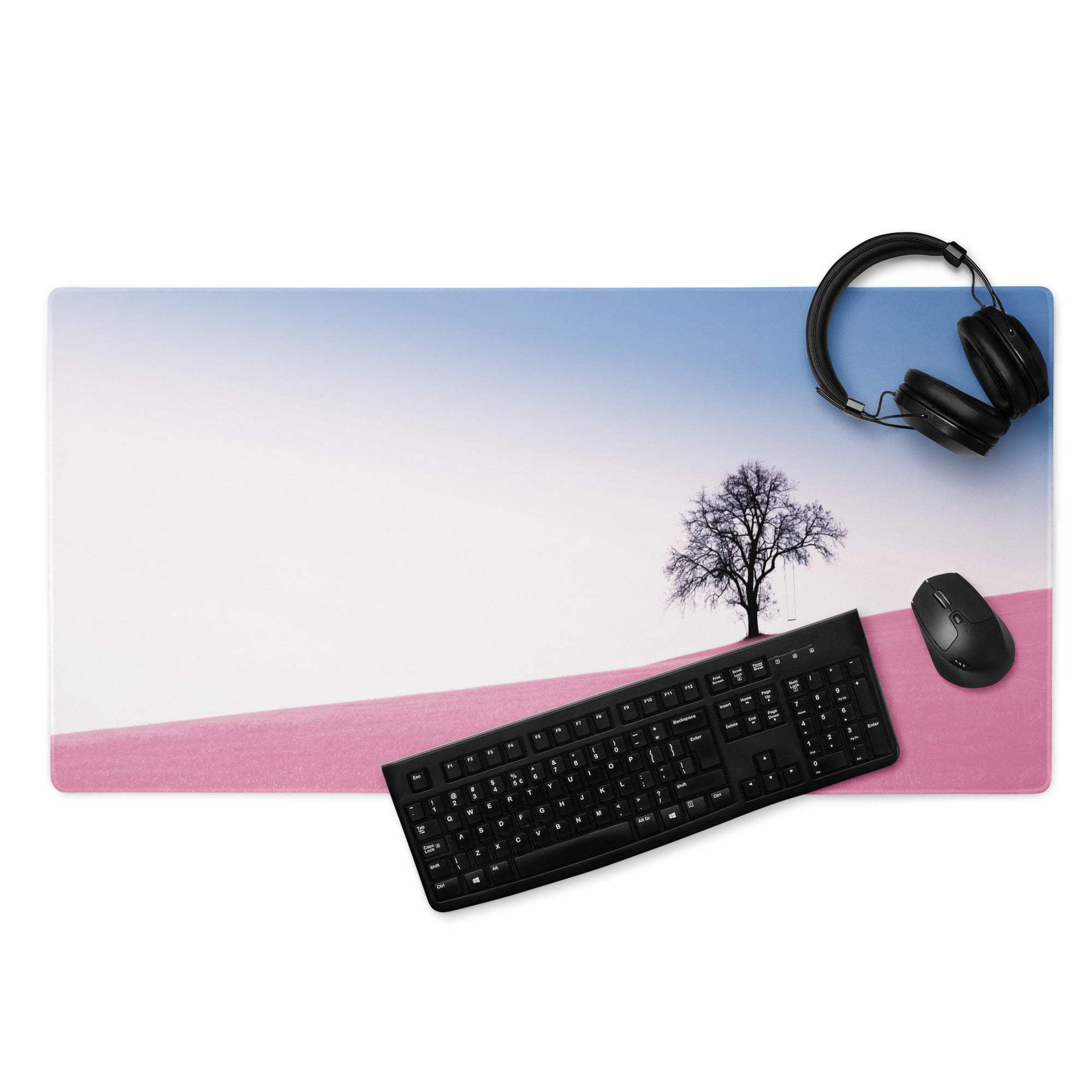 Large pastel pink landscape gaming mouse pad with serene tree design