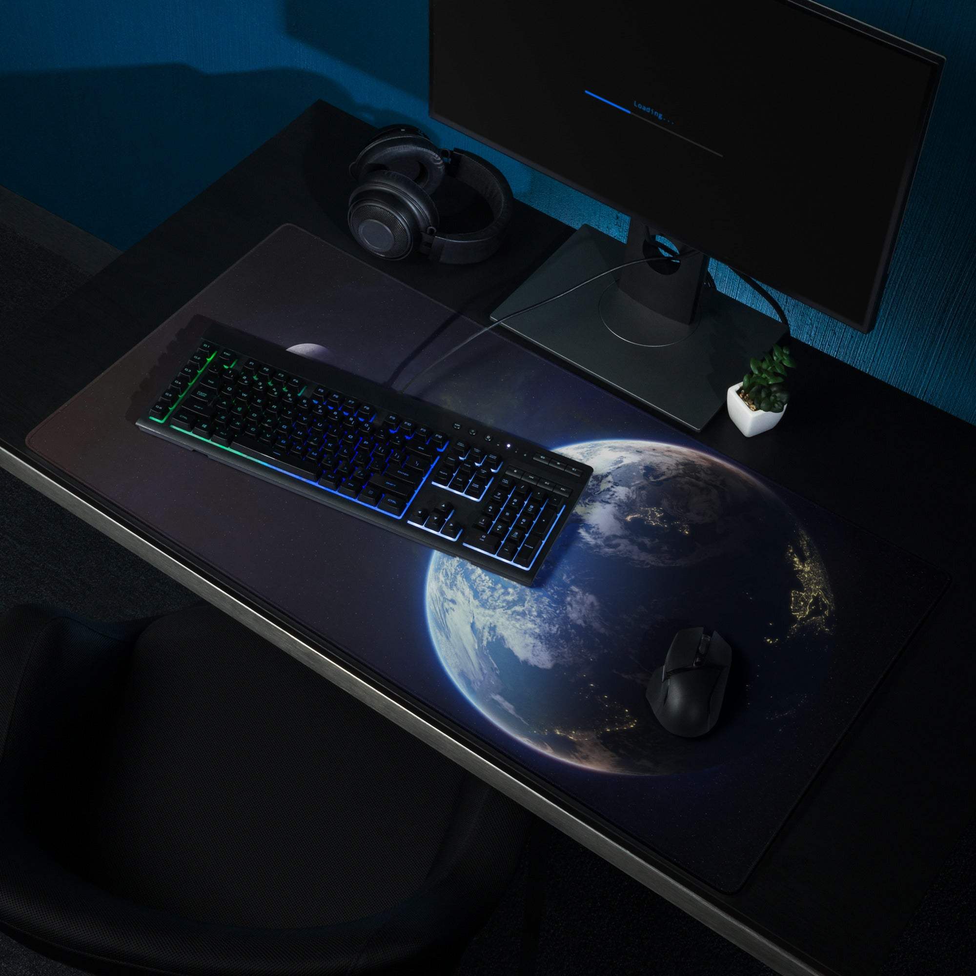 Black gaming mousepad with illuminated Earth from space design