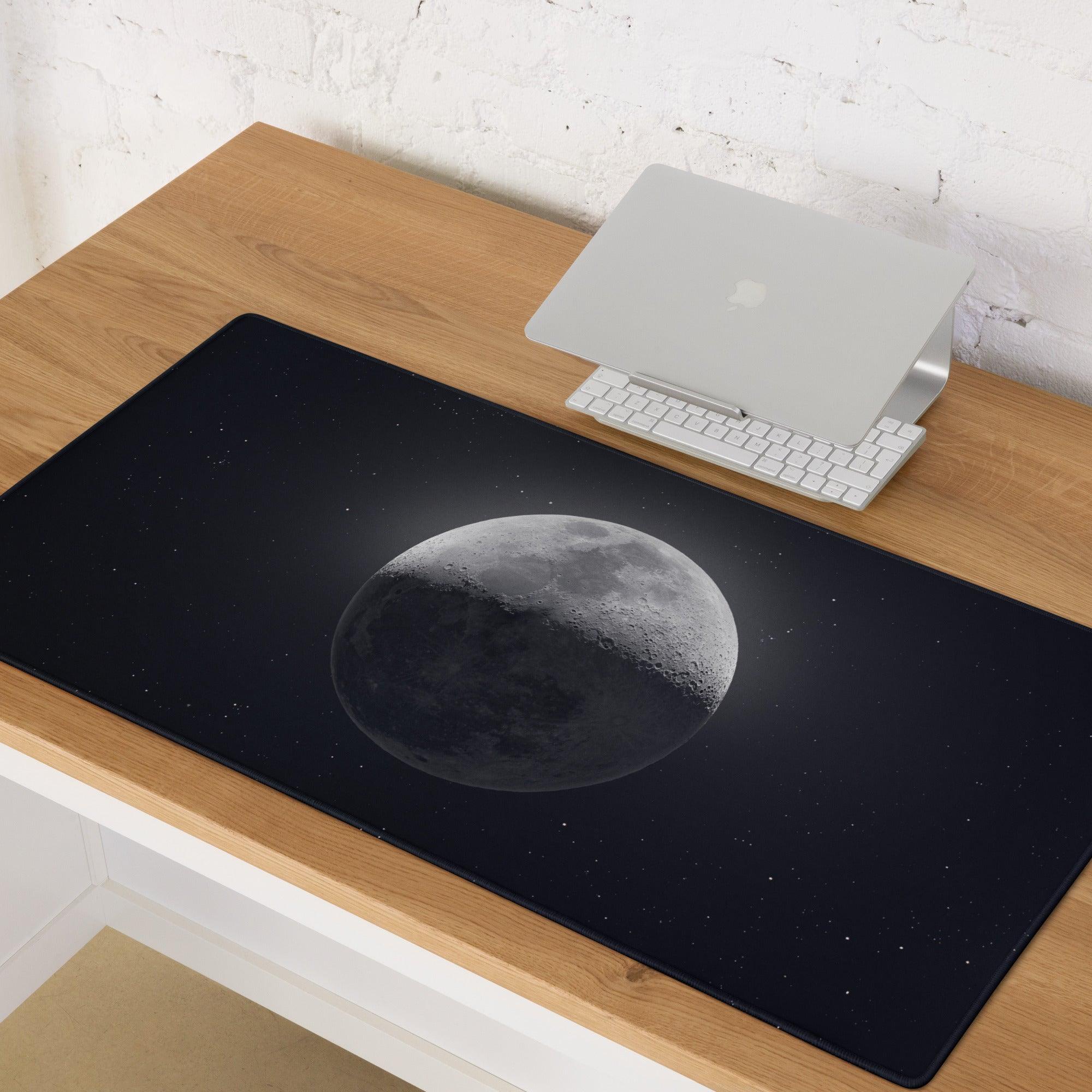 Large black gaming mouse pad with grayscale moon and starry sky design