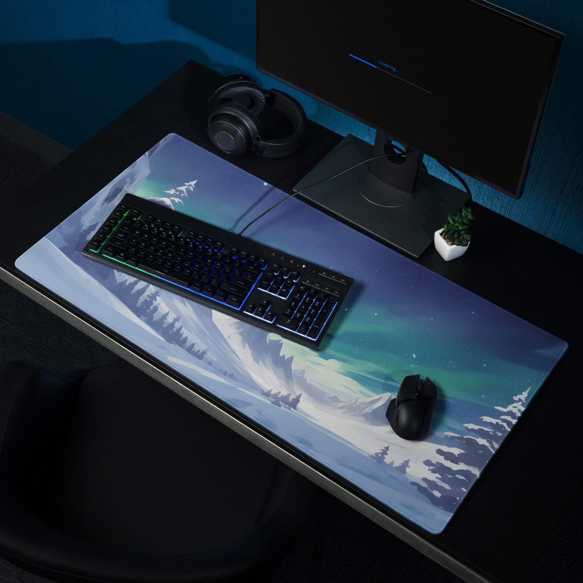 Blue and white aurora borealis gaming mousepad with snowy mountains, pine trees, large surface, non-slip backing