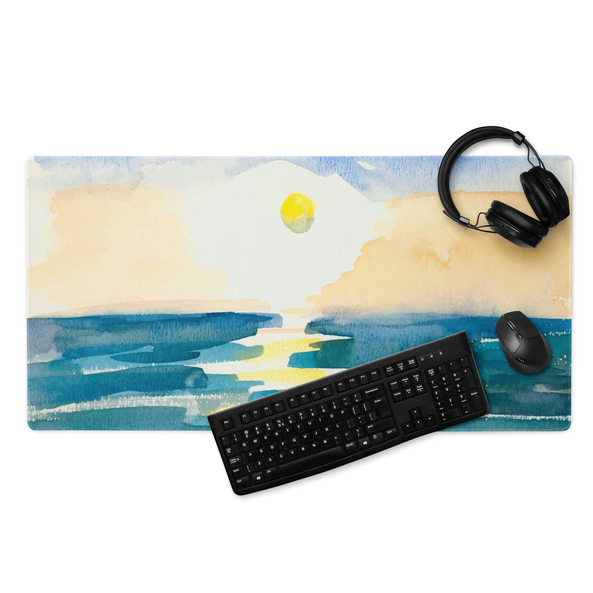Large watercolor ocean sunset desk mat with black keyboard and mouse