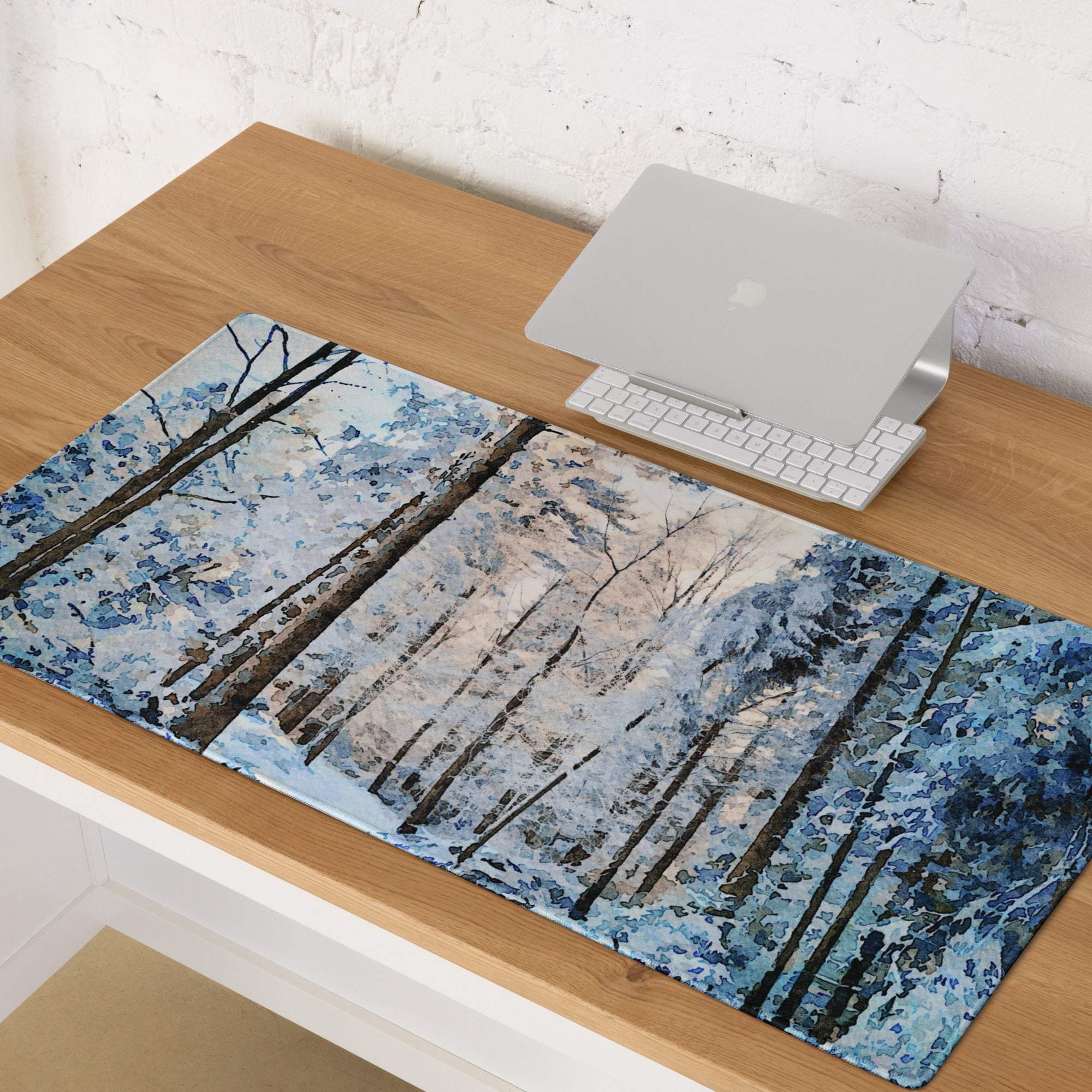 Blue and white snowy forest gaming mouse pad with non-slip base