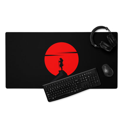 Black gaming mousepad with red sun silhouetted anime character on cliff