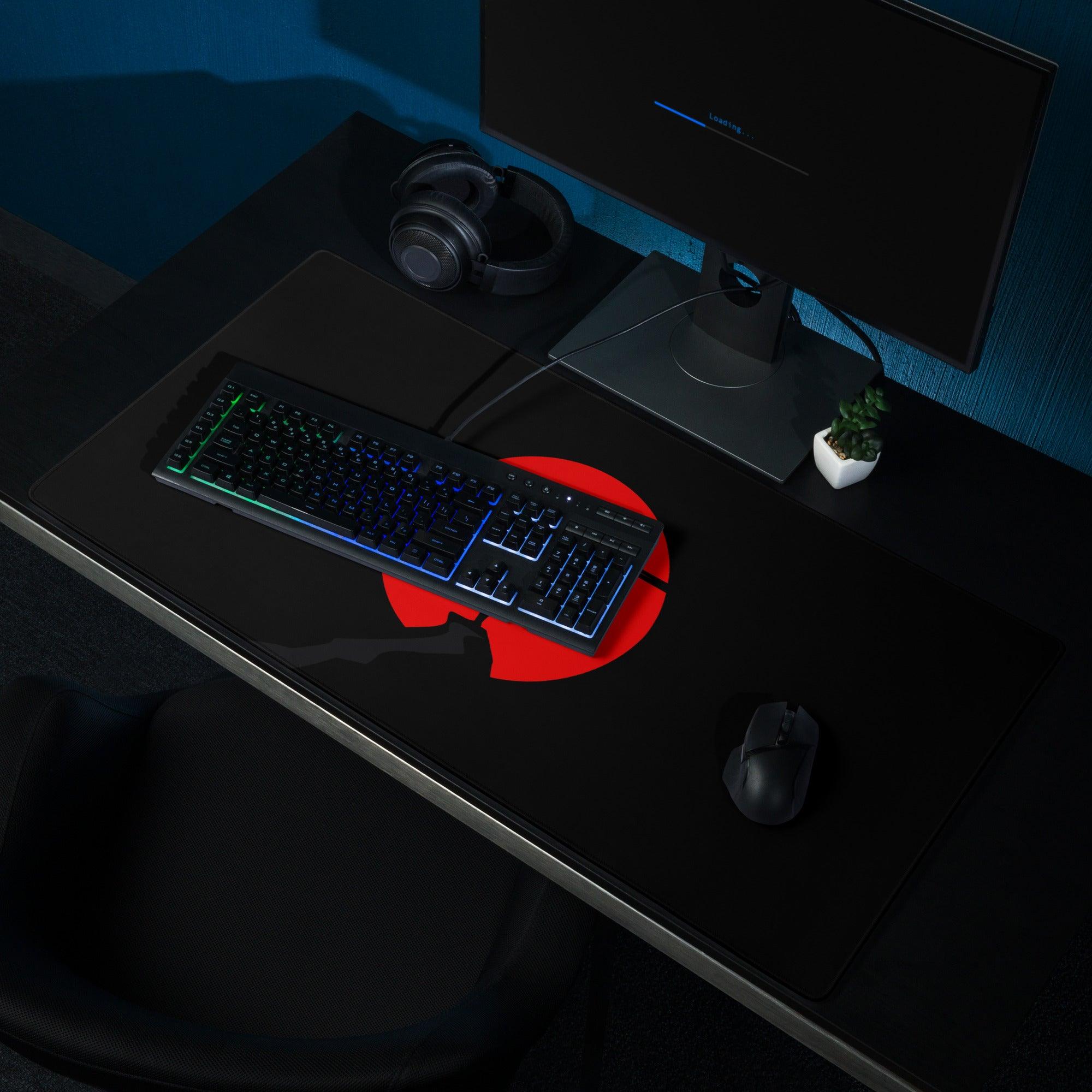 Black gaming mousepad with bold red sun silhouette and broken edge design