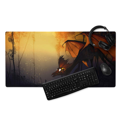 Black dragon gaming mousepad with glowing eyes on sunset backdrop