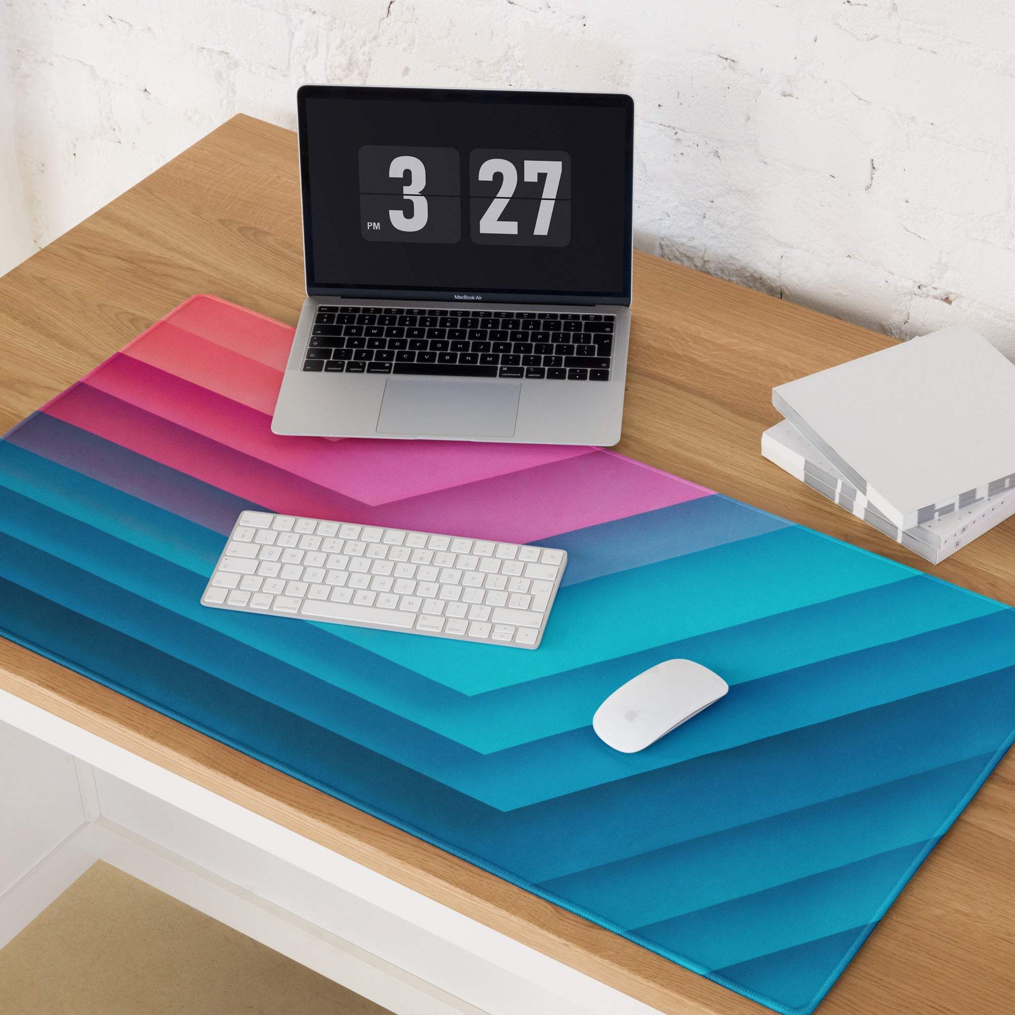 Vibrant pink to blue gradient diagonal striped gaming mouse pad