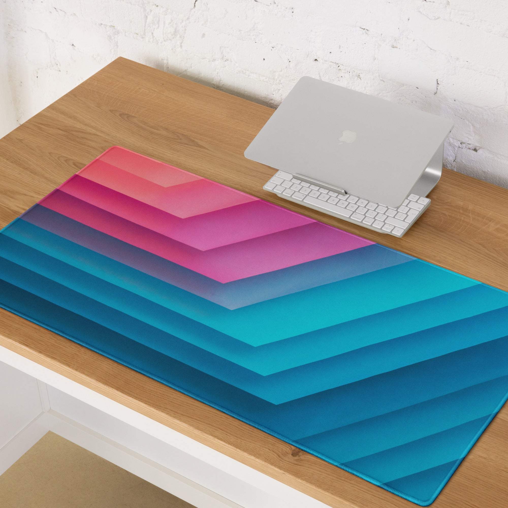 Gradient geometric pink to blue large gaming mouse pad with chevron stripes