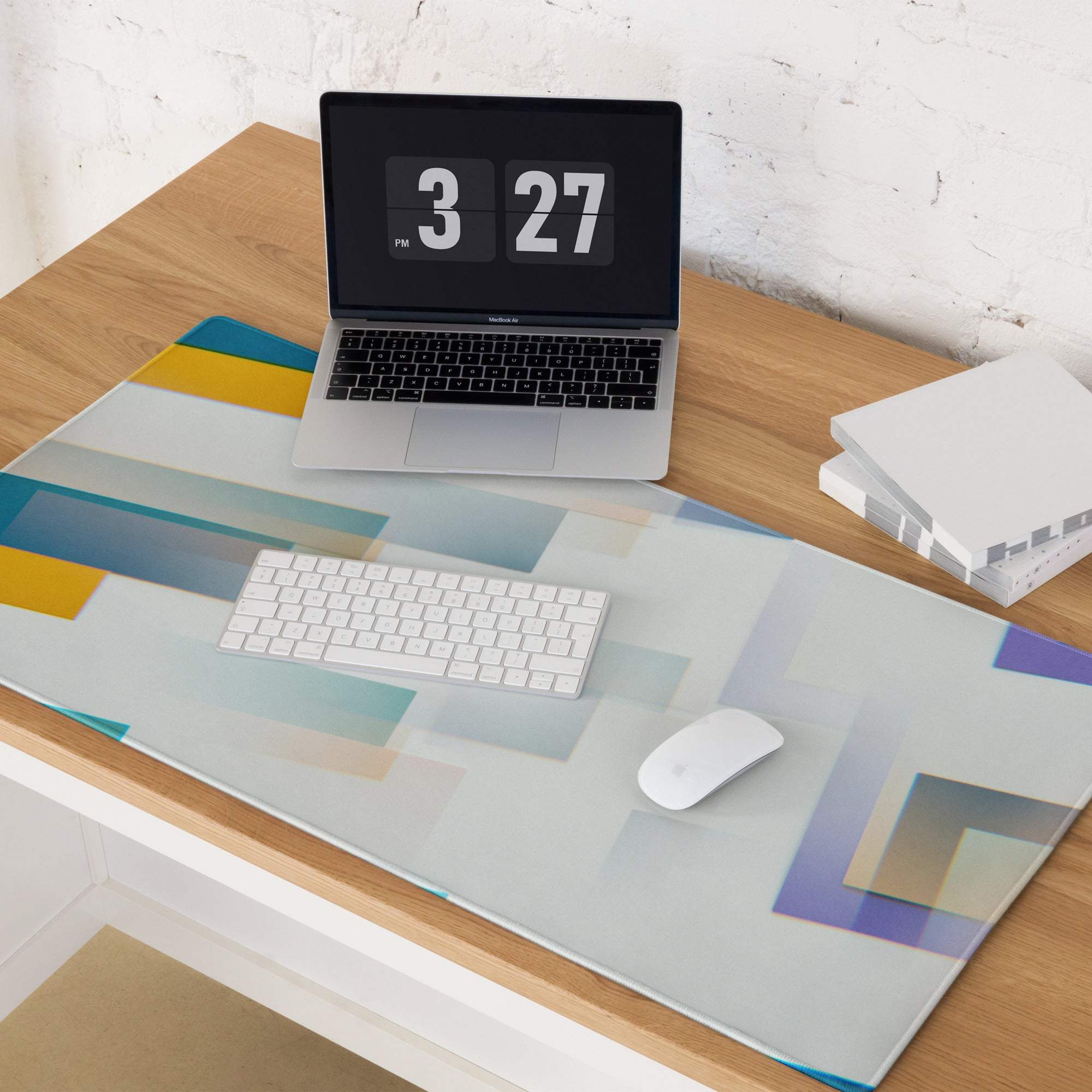 Large colorful abstract geometric gaming mouse pad in pastel blue, yellow, purple with non-slip base