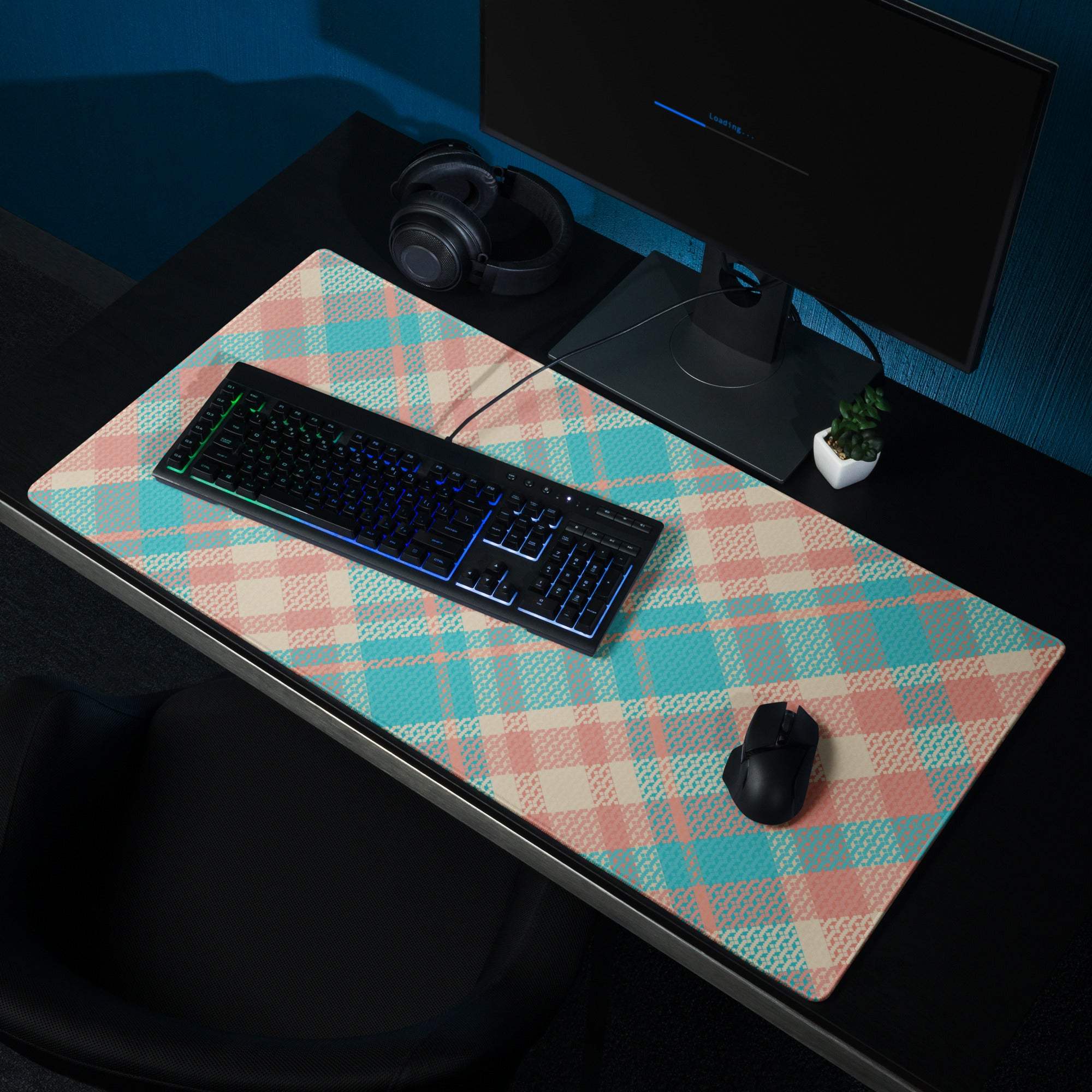Pastel plaid gaming mousepad in teal peach tones with matte finish non-slip base