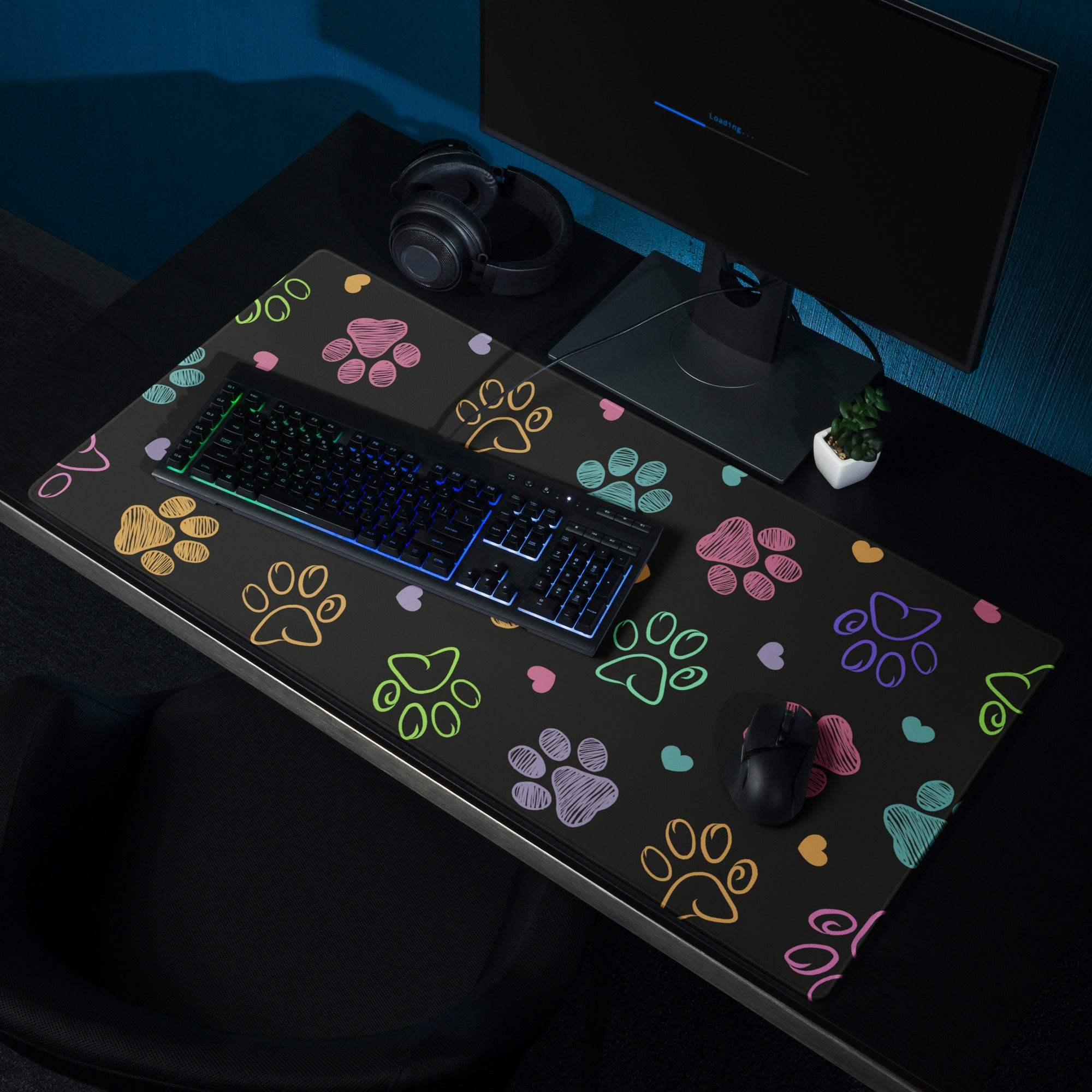 Large colorful paw print gaming mouse pad with non-slip base, black with vibrant prints