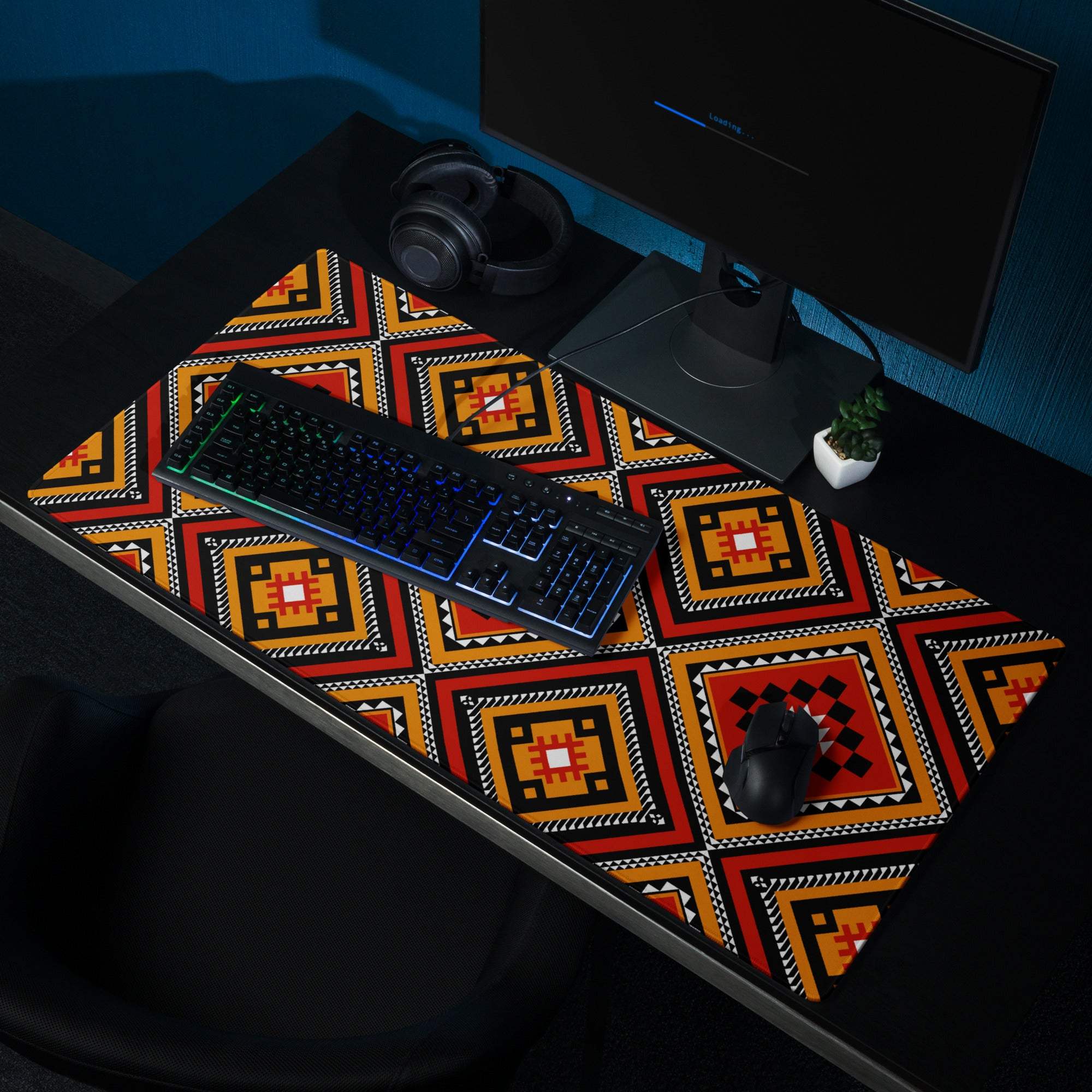 Vibrant tribal geometric diamond motif gaming mouse pad in bold red orange black white
