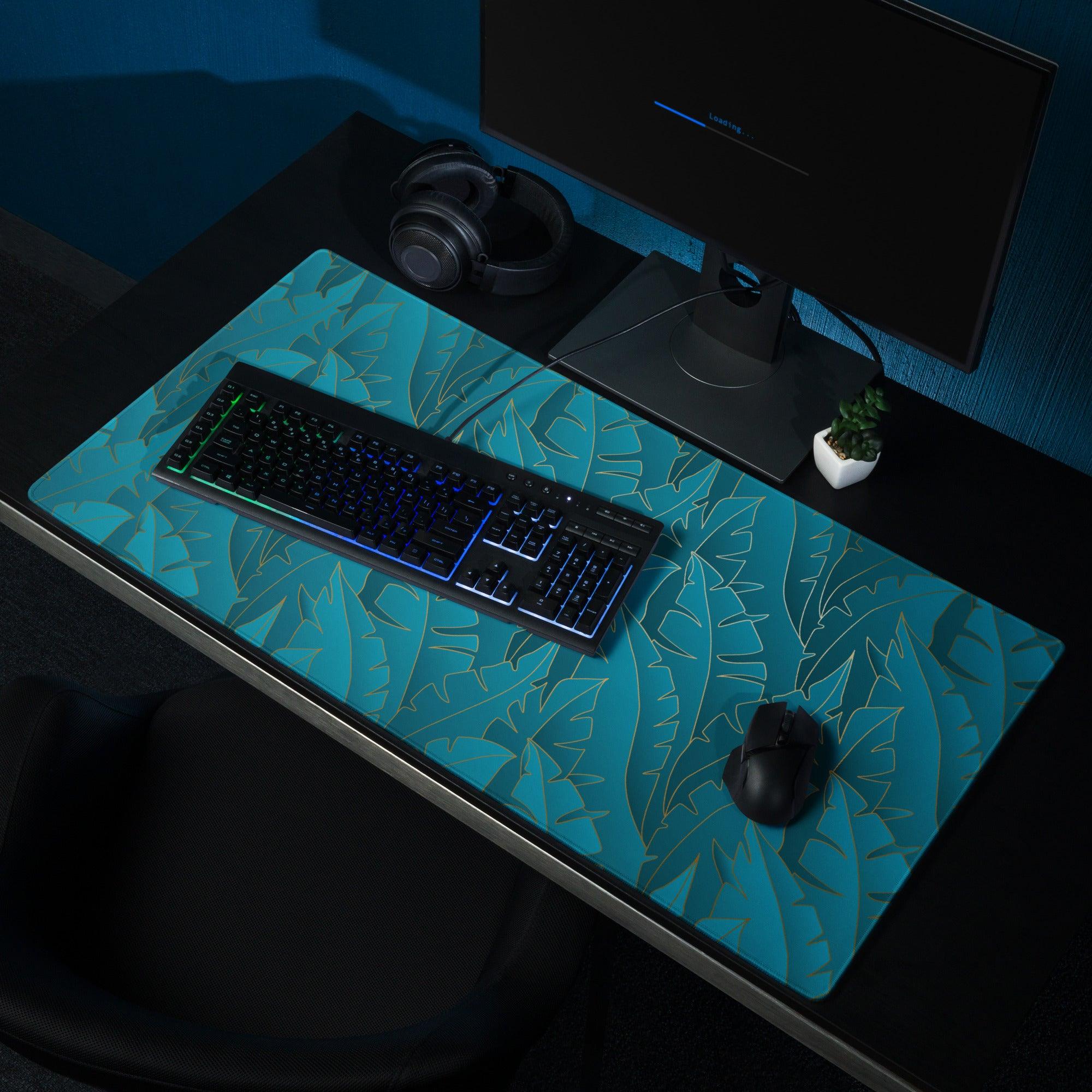 Tropical leaf teal gaming mouse pad with non-slip base and stitching