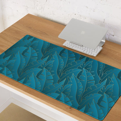 Teal tropical leaf mousepad with metallic sheen, non-slip base, edge stitching