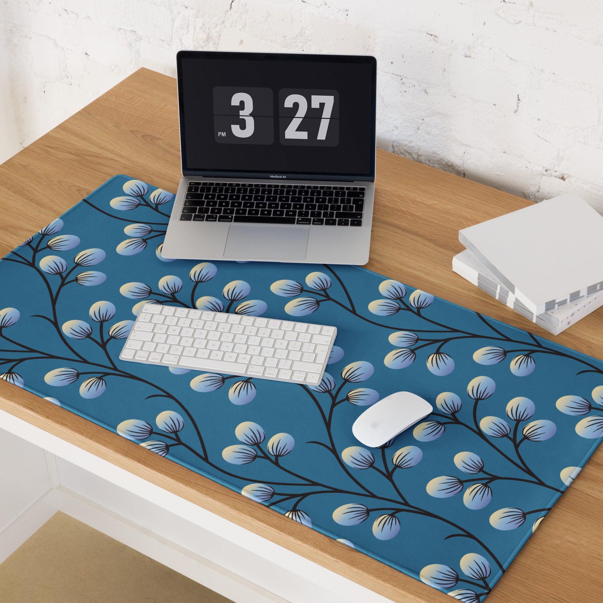 Blue gaming mouse pad with black branch pattern and light blue buds