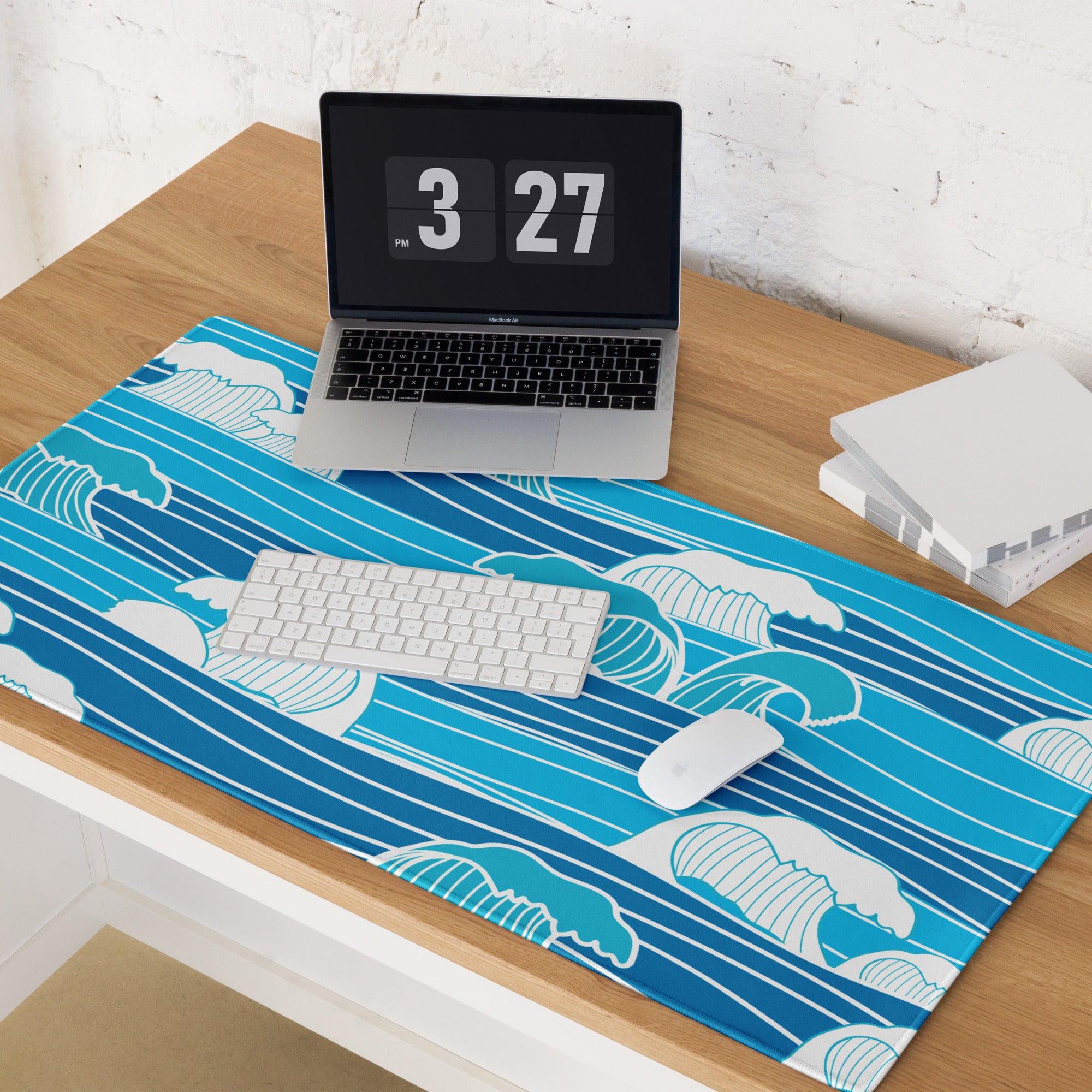 Blue wave-patterned gaming mouse pad with white teal accents non-slip surface