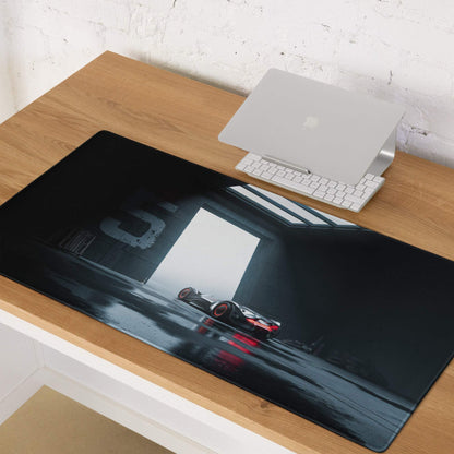 Moody Blue red black racing car gaming mouse pad in dim garage lighting