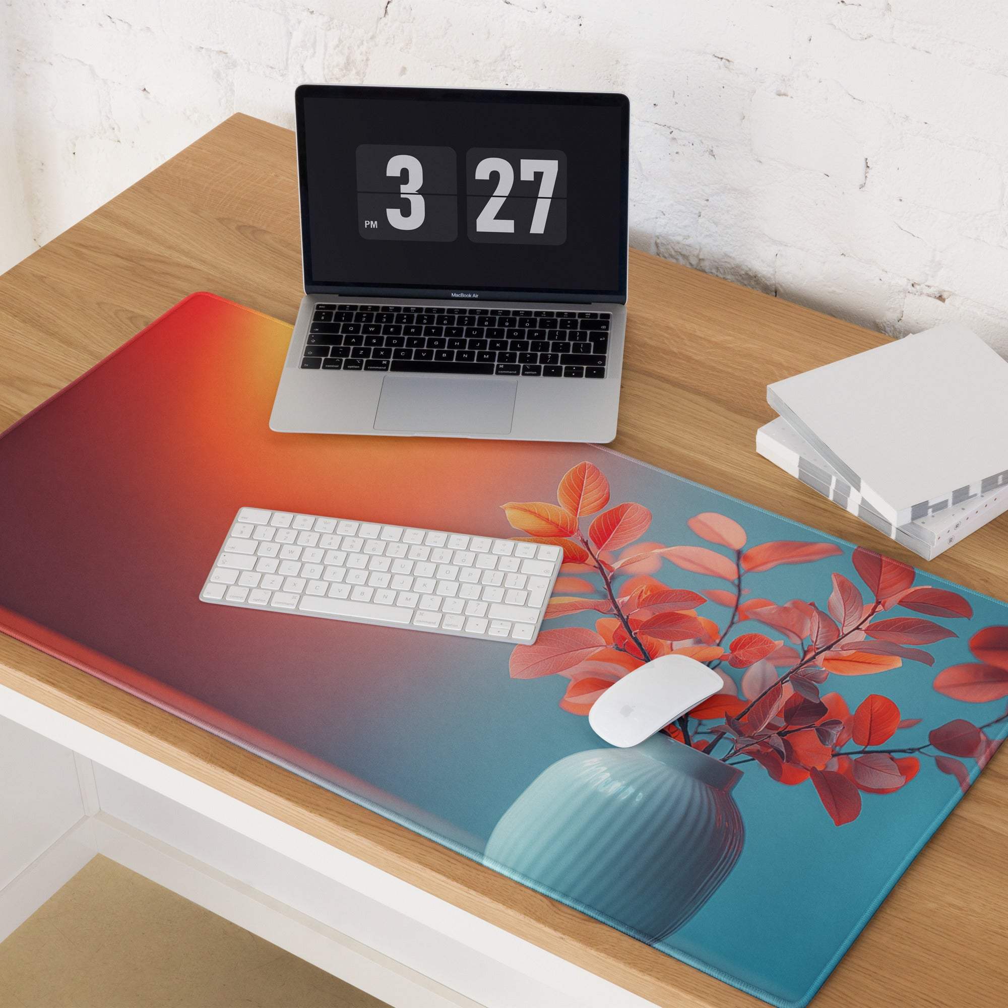 Vibrant orange-to-teal gradient gaming mouse pad with leaves in vase