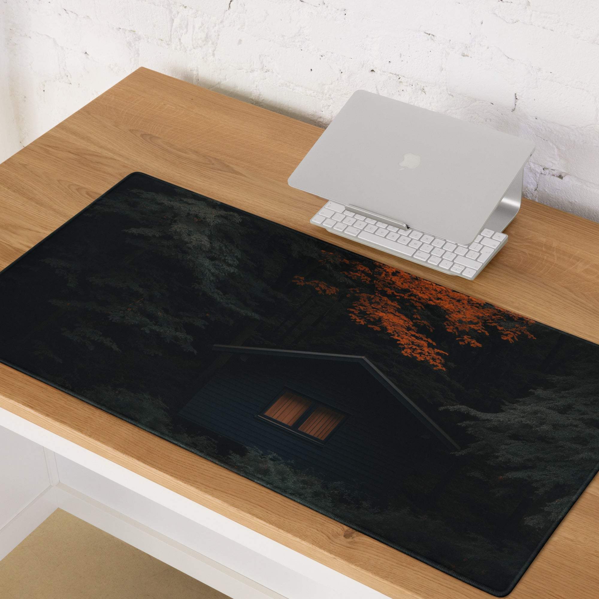 Mystic Forest Cabin gaming mouse pad with dark forest, lit cabin, autumn leaves