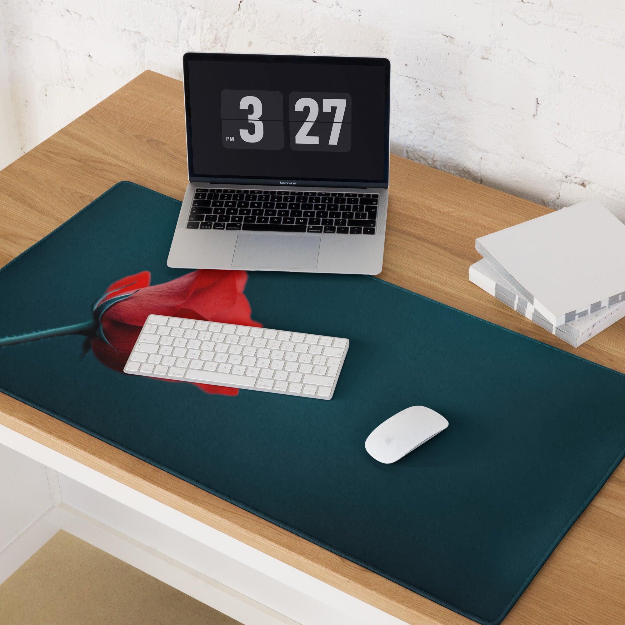 Teal gaming mousepad with vibrant red poppy flower on deep backdrop, non-slip stitching