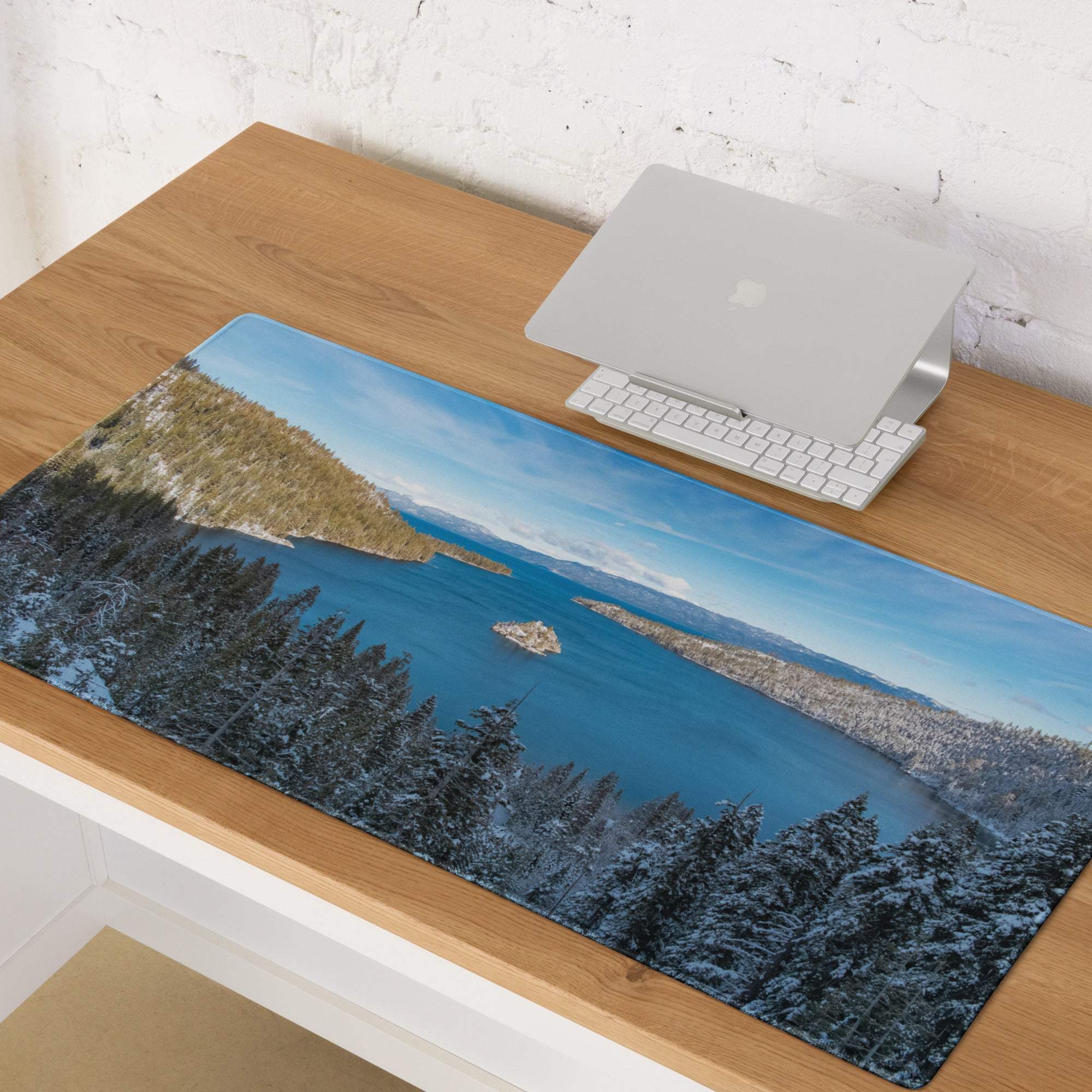 Serene winter lake mouse pad with snow pines, non-slip base, stitched edges