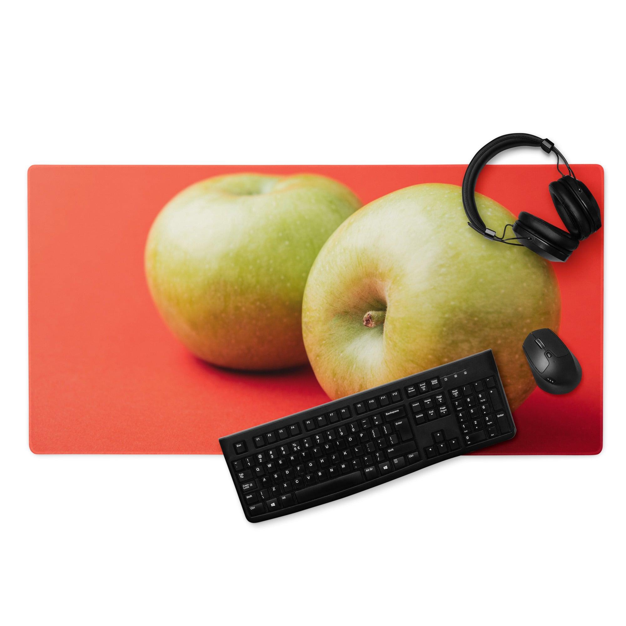 Vibrant green apple duo on rectangular red gaming mouse pad with non-slip base
