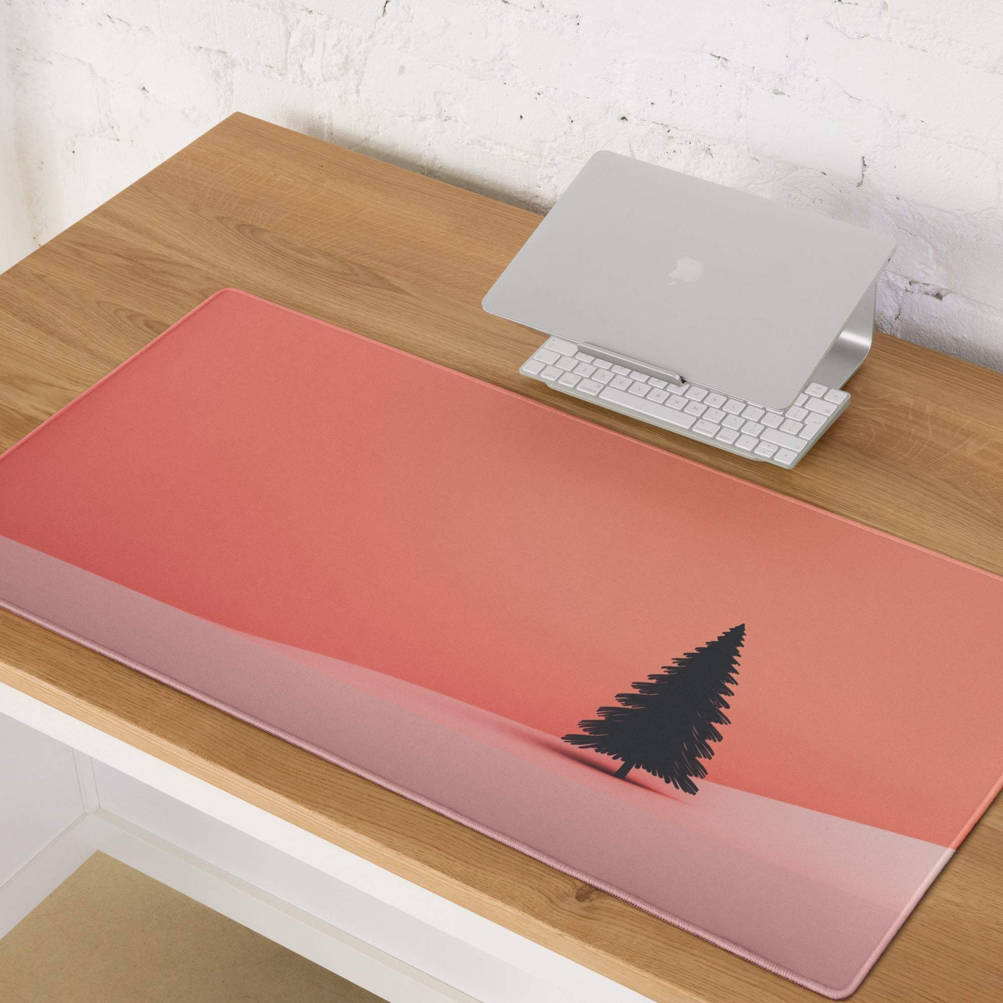 Minimalist sunset tree gaming mouse pad with coral pink gradient and non-slip base