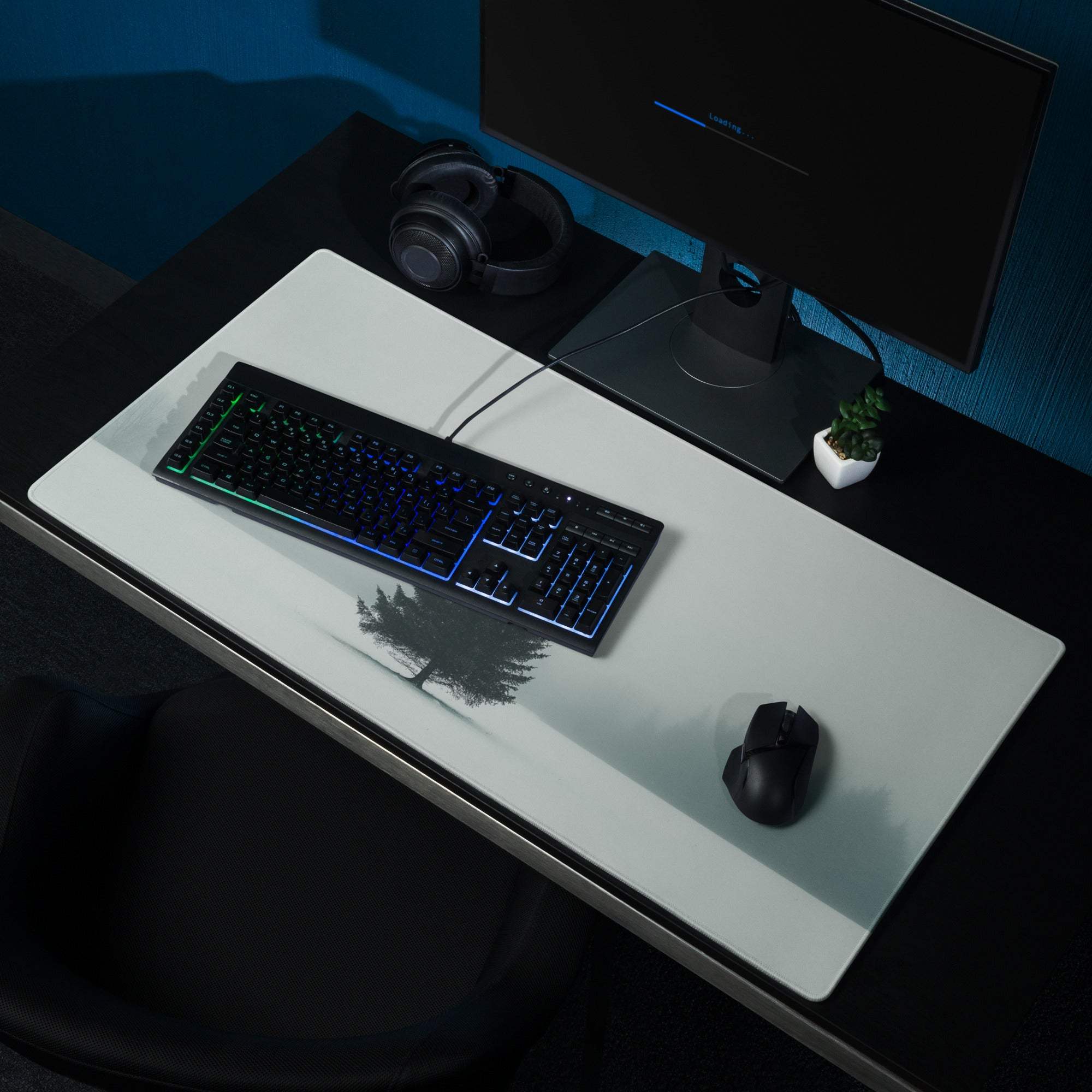 Minimalist white gaming mouse pad with black winter tree silhouette