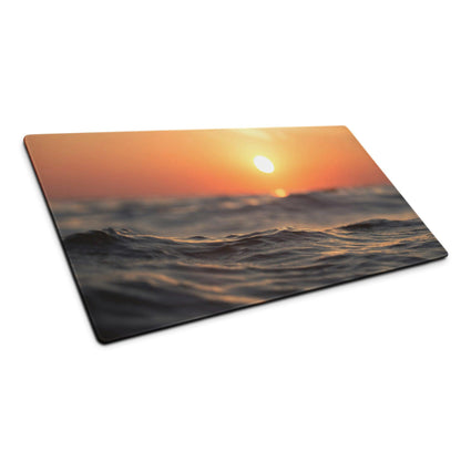 Warm sunset ocean waves gaming mouse pad with orange sun over textured waves