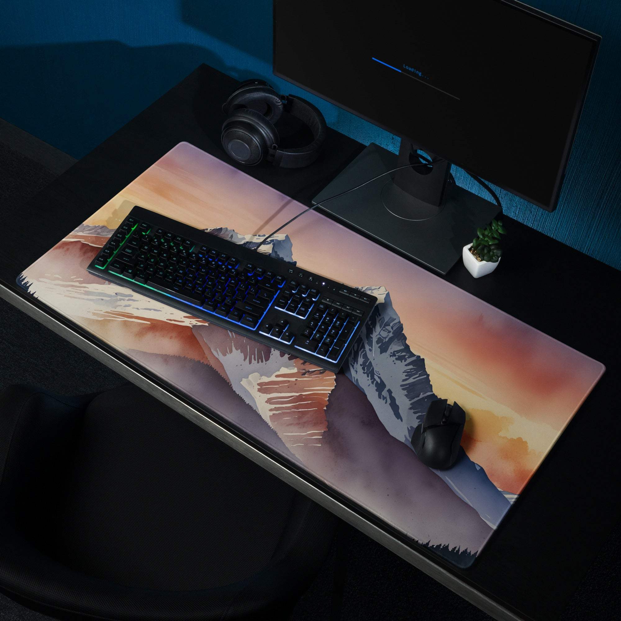 Epic Mountain Sunrise gaming mouse pad with watercolor peaks on dark desk