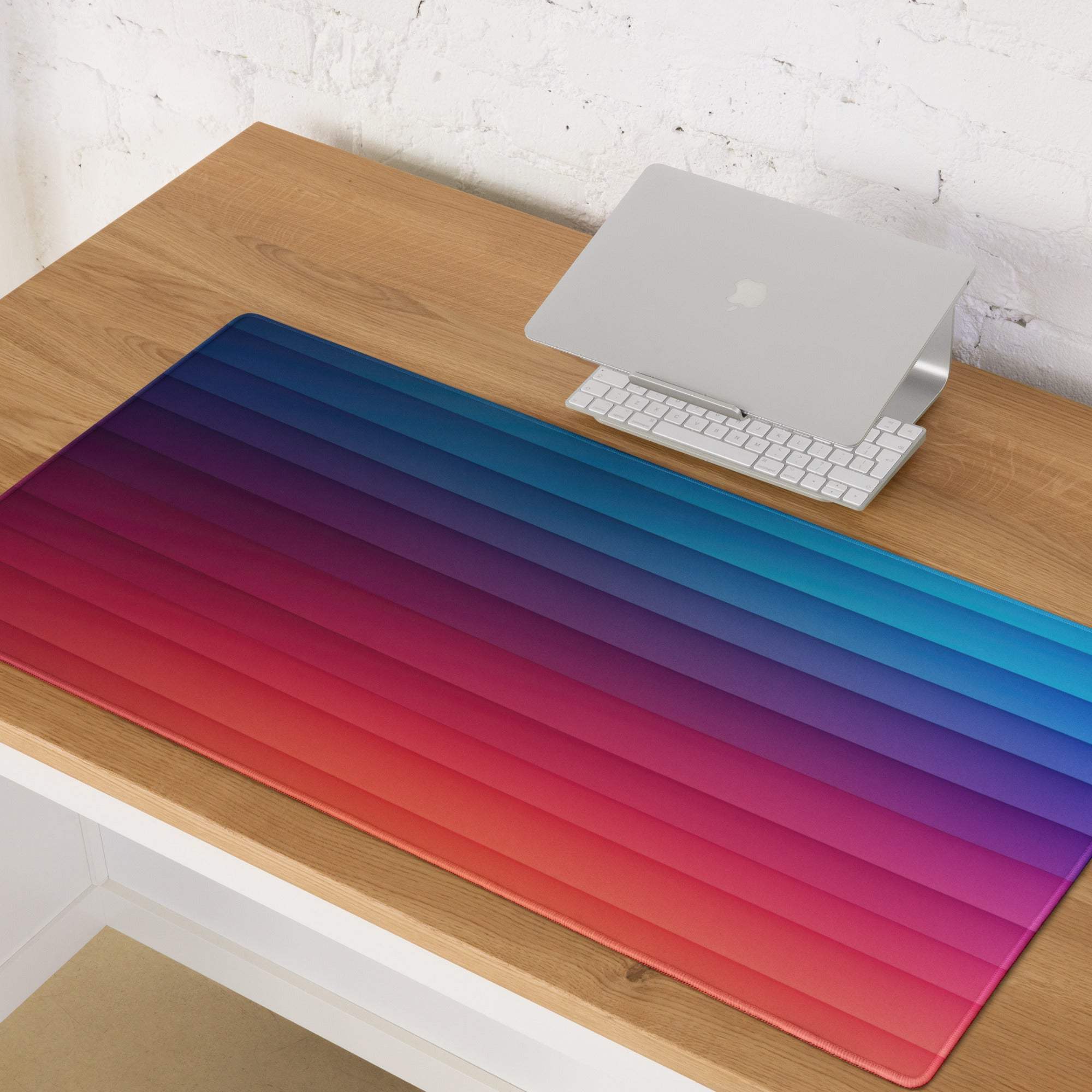 Vibrant gradient rainbow gaming mouse pad with ribbed texture and non-slip base