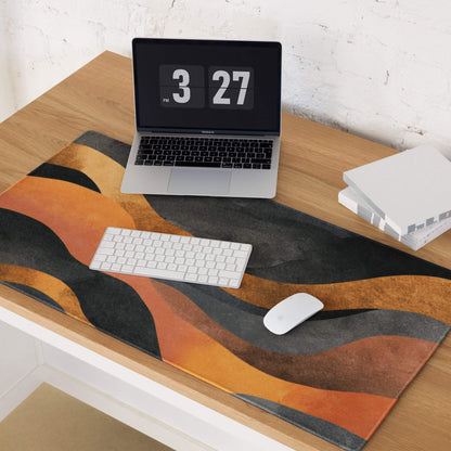 Fiery orange and black abstract wave desk mat with non-slip backing