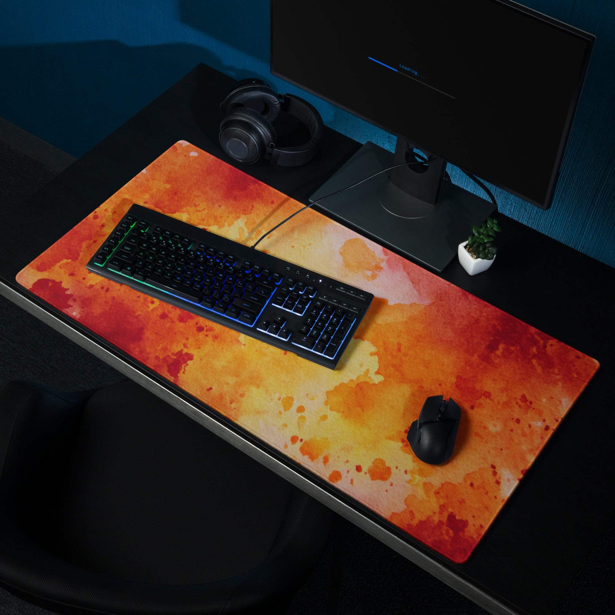 Vibrant orange yellow watercolor gaming mousepad with black keyboard mouse