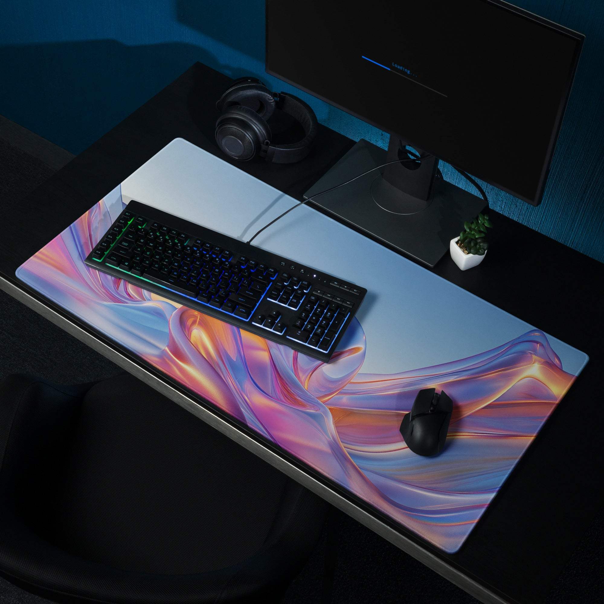 Vibrant pink purple orange swirl gaming mousepad with non-slip base stitching