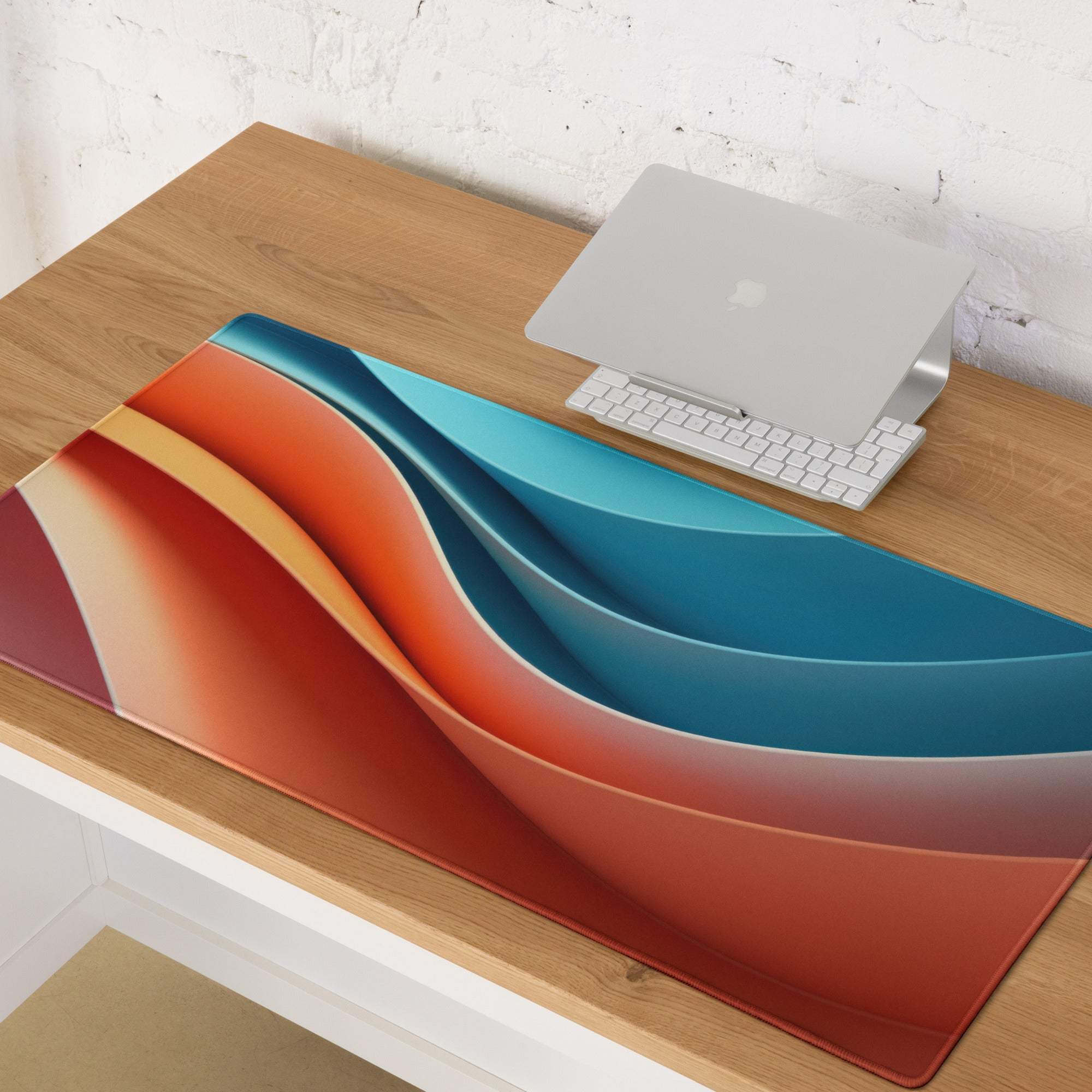 Abstract wave gaming mouse pad with orange, red, teal gradients