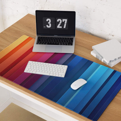 Vibrant rainbow gradient gaming mouse pad with diagonal stripes and non-slip base