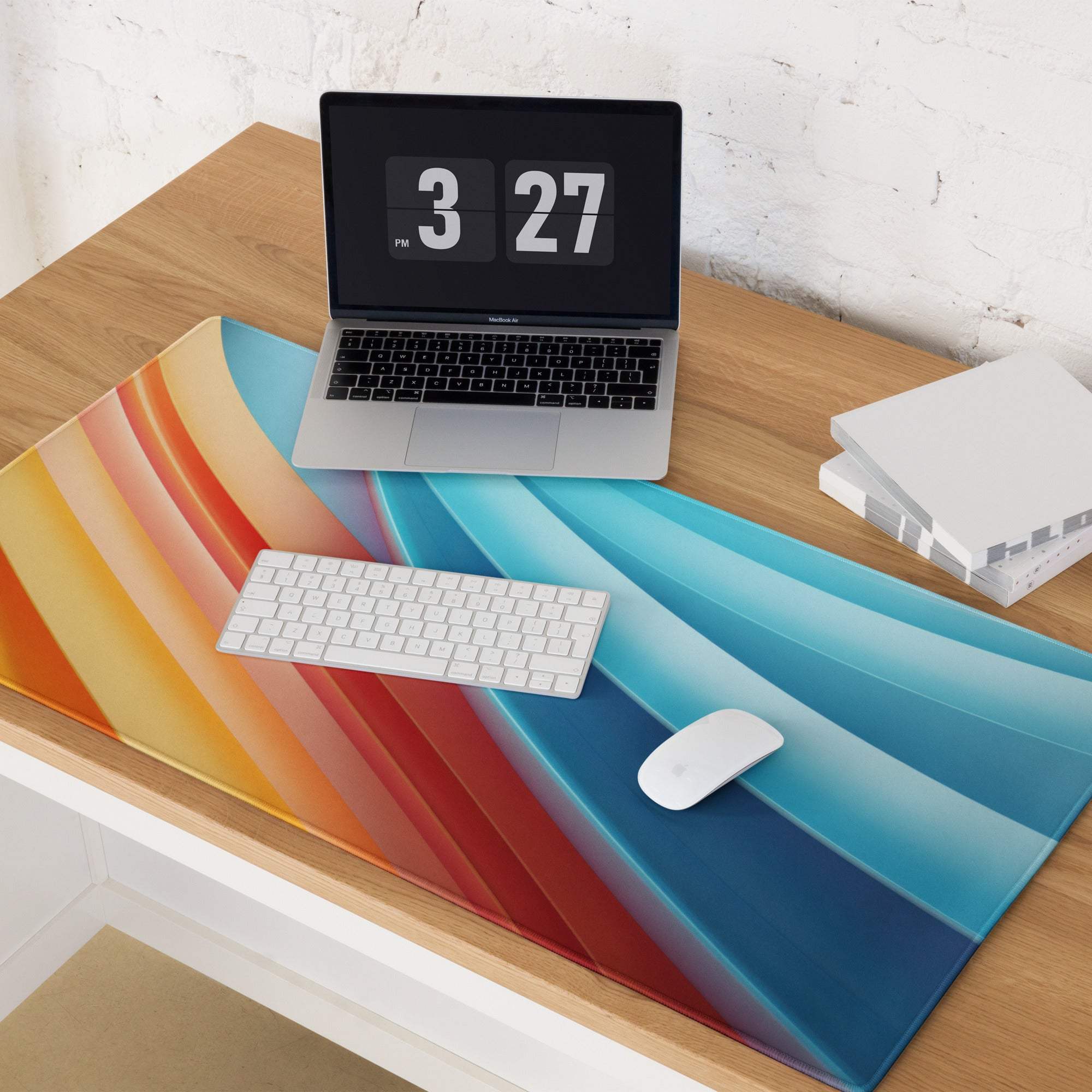 Vibrant rainbow-striped glossy gaming mouse pad with non-slip base
