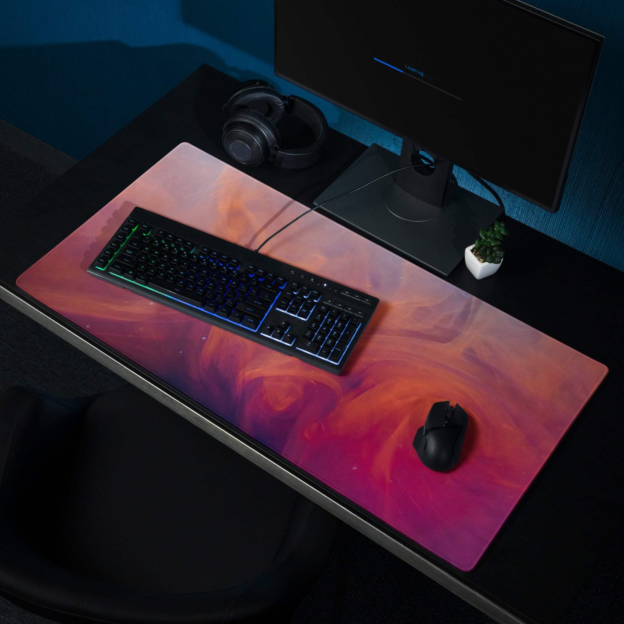 Large vibrant gradient gaming mouse pad with pink orange purple swirls non-slip base edge stitching Dota CSGO setup