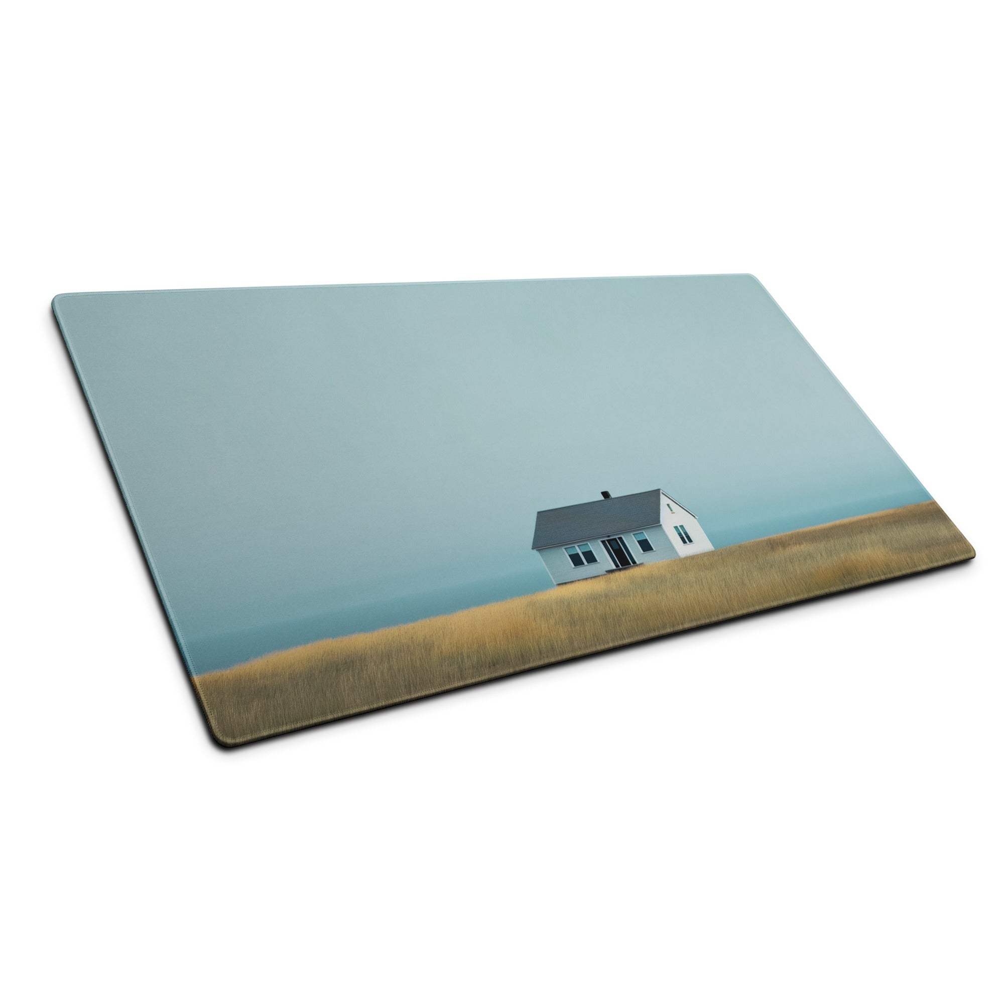 Calm coastal house scene on large rectangular glass gaming mouse pad