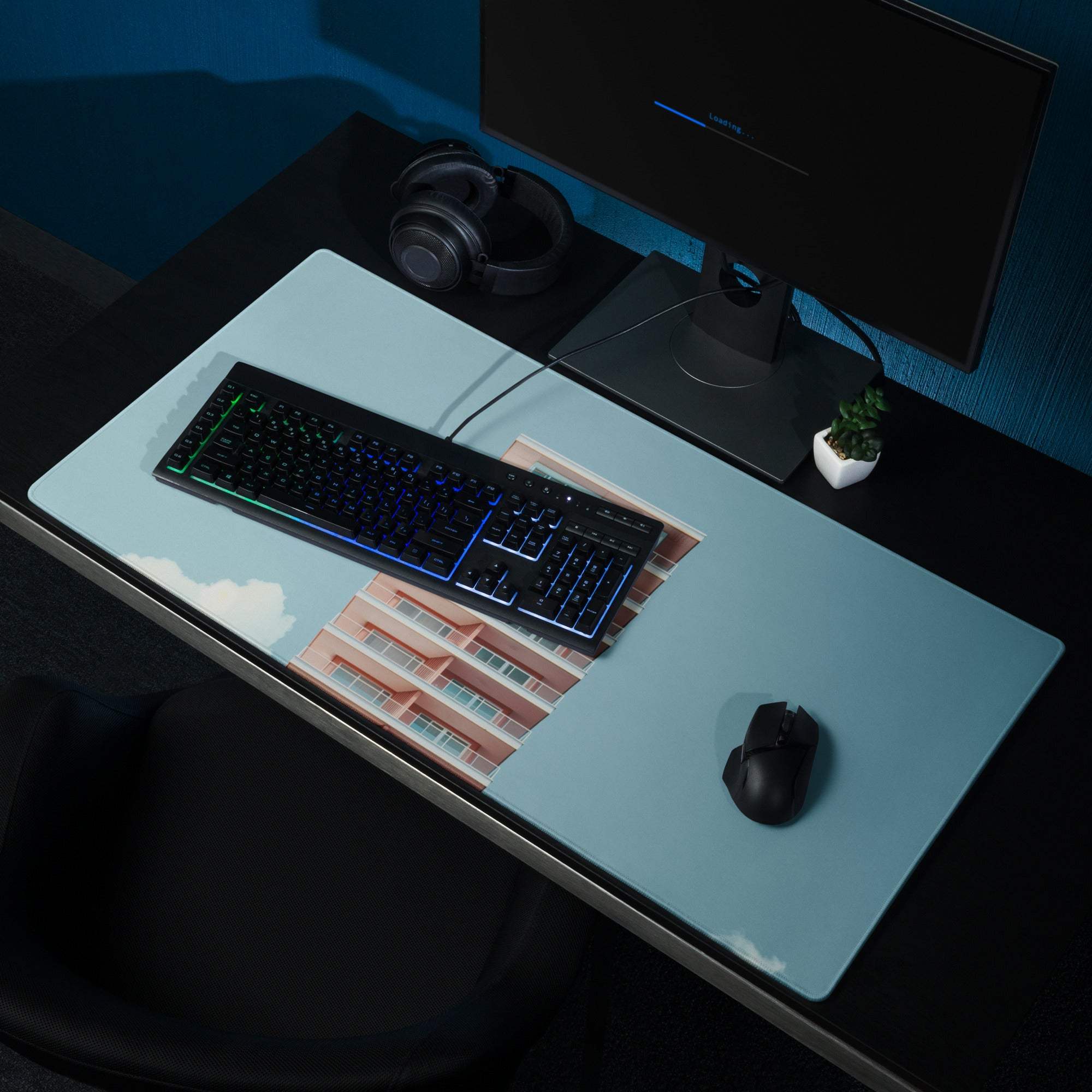 Light blue gaming mousepad with pink building, clouds, non-slip base