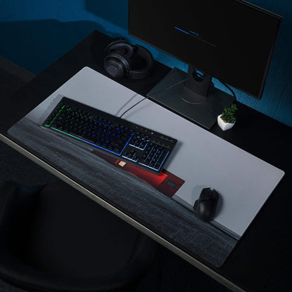 Black RGB keyboard on minimalist red dusk gaming mouse pad with wrist rest