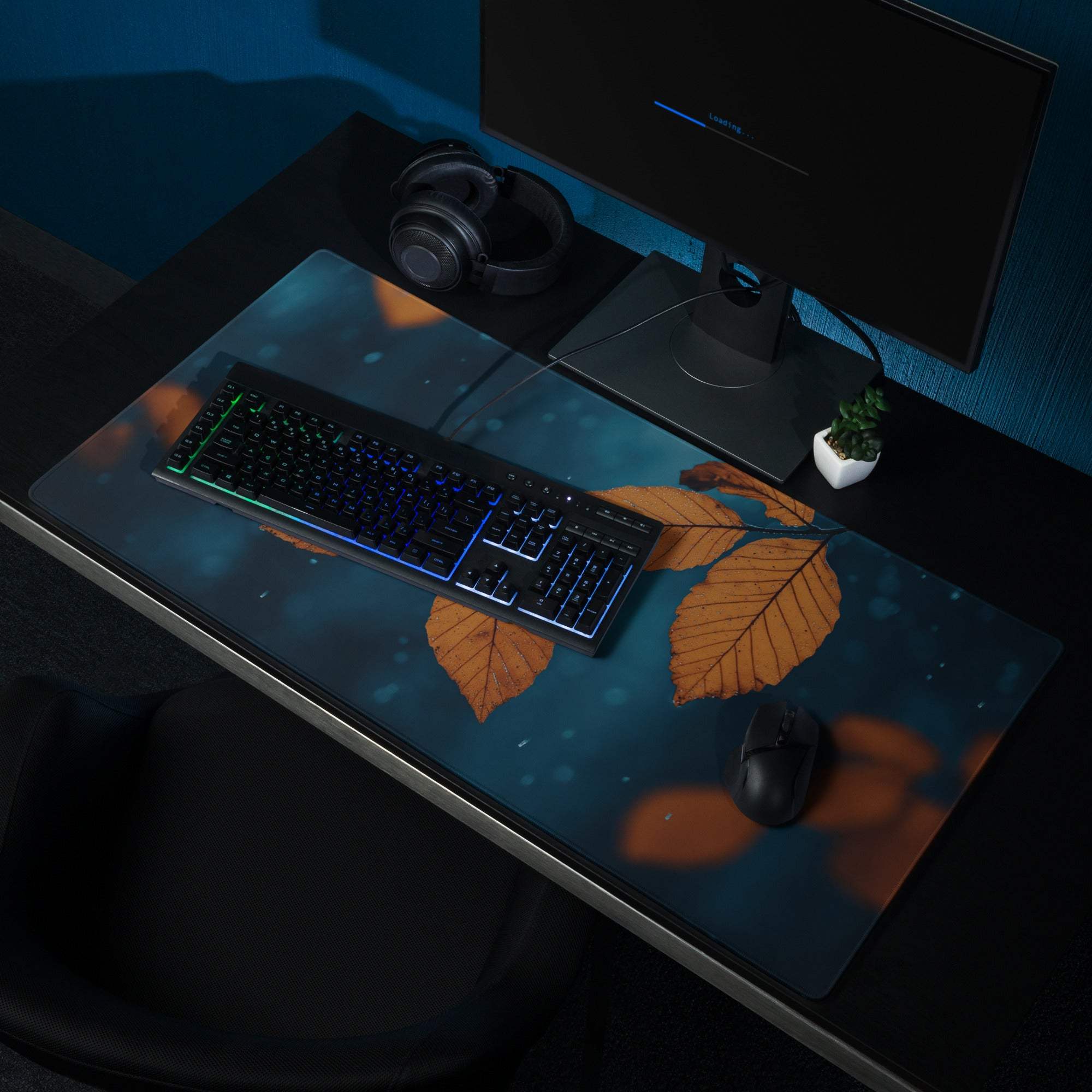 Nature-inspired autumn leaves on deep blue large gaming mouse pad