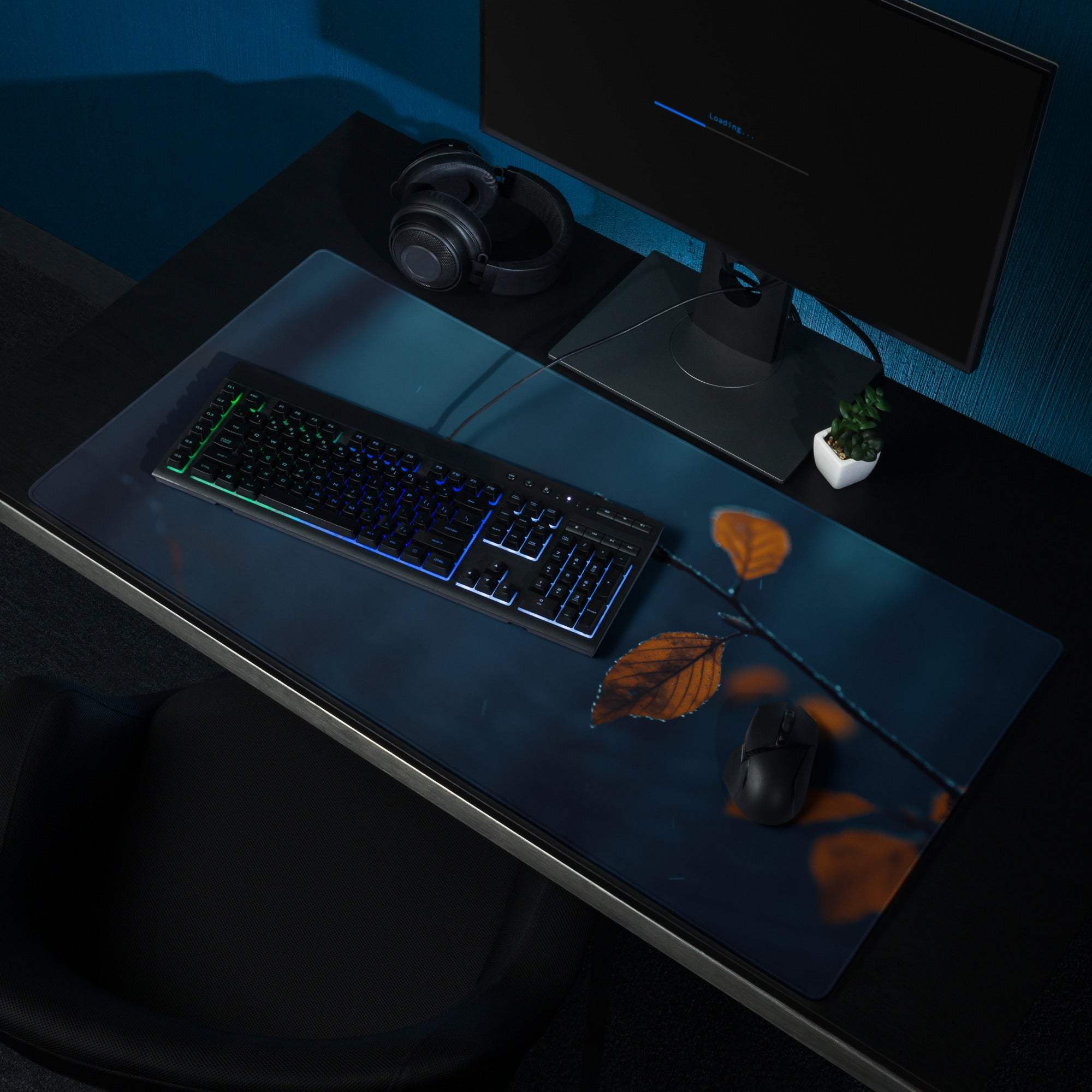 Dark blue gaming mousepad with orange autumn leaves on branch design