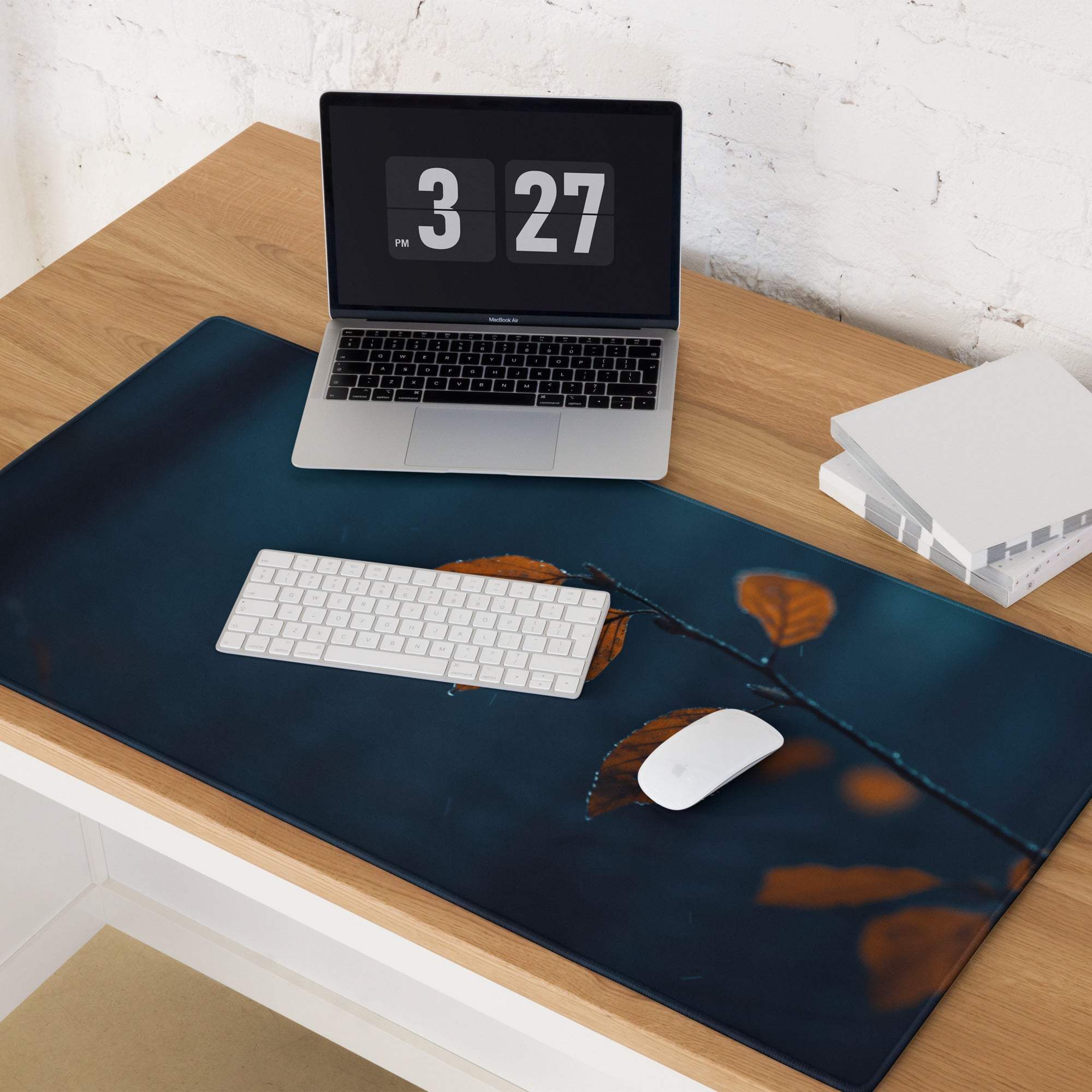 Dark blue gaming mouse pad with moody night scene autumn leaves on branch