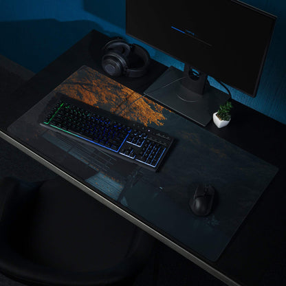 Black gaming mousepad with moody autumn forest orange brown mountain design