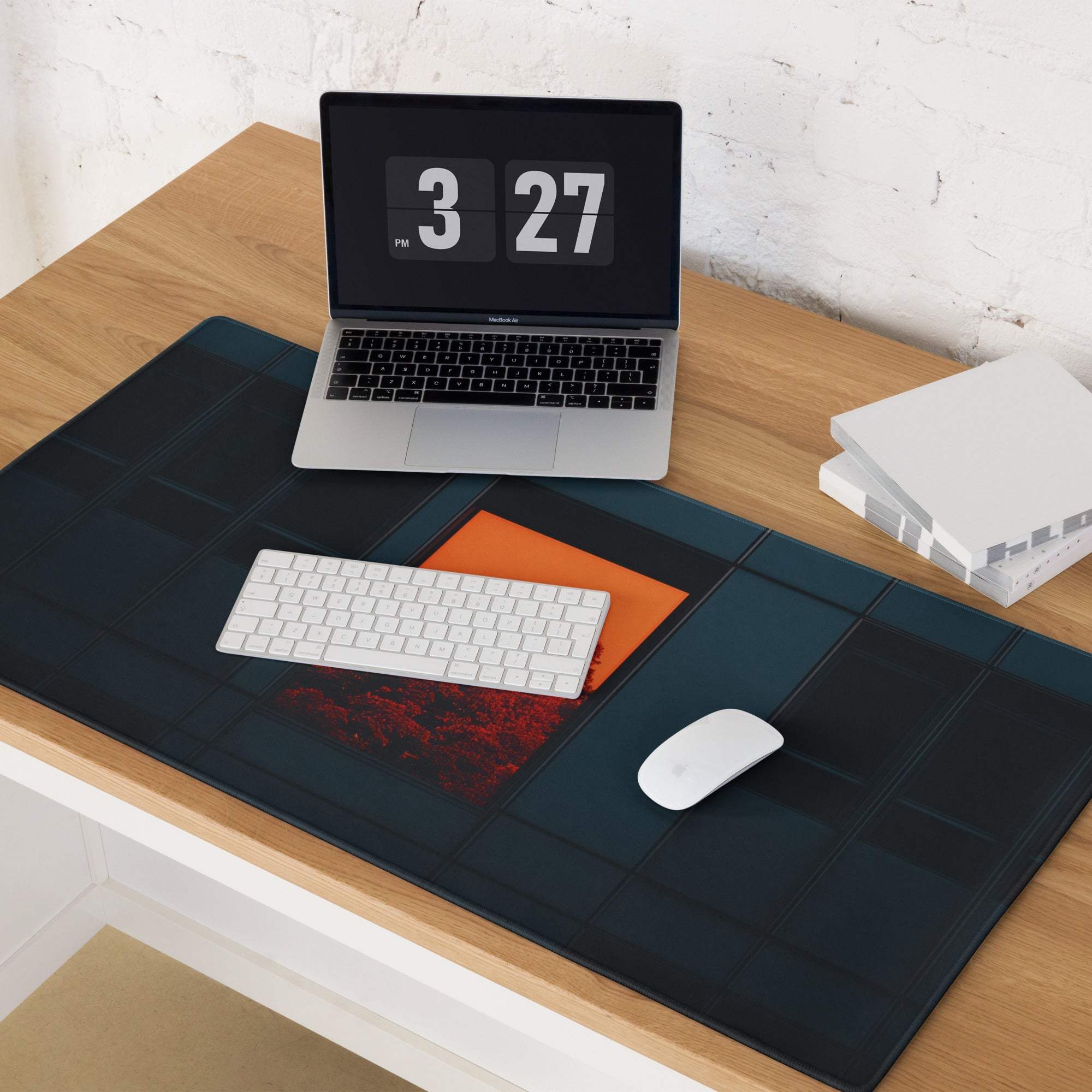 Modern dark blue gaming mouse pad with orange-red grid accent