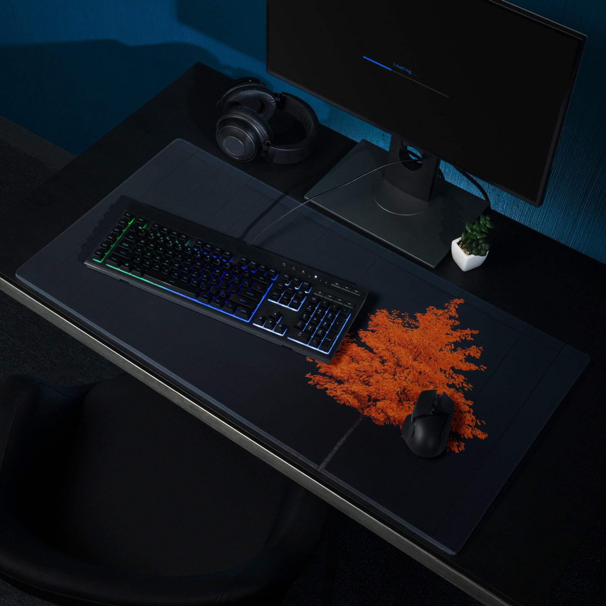 Black gaming mousepad with orange flame and autumn tree design