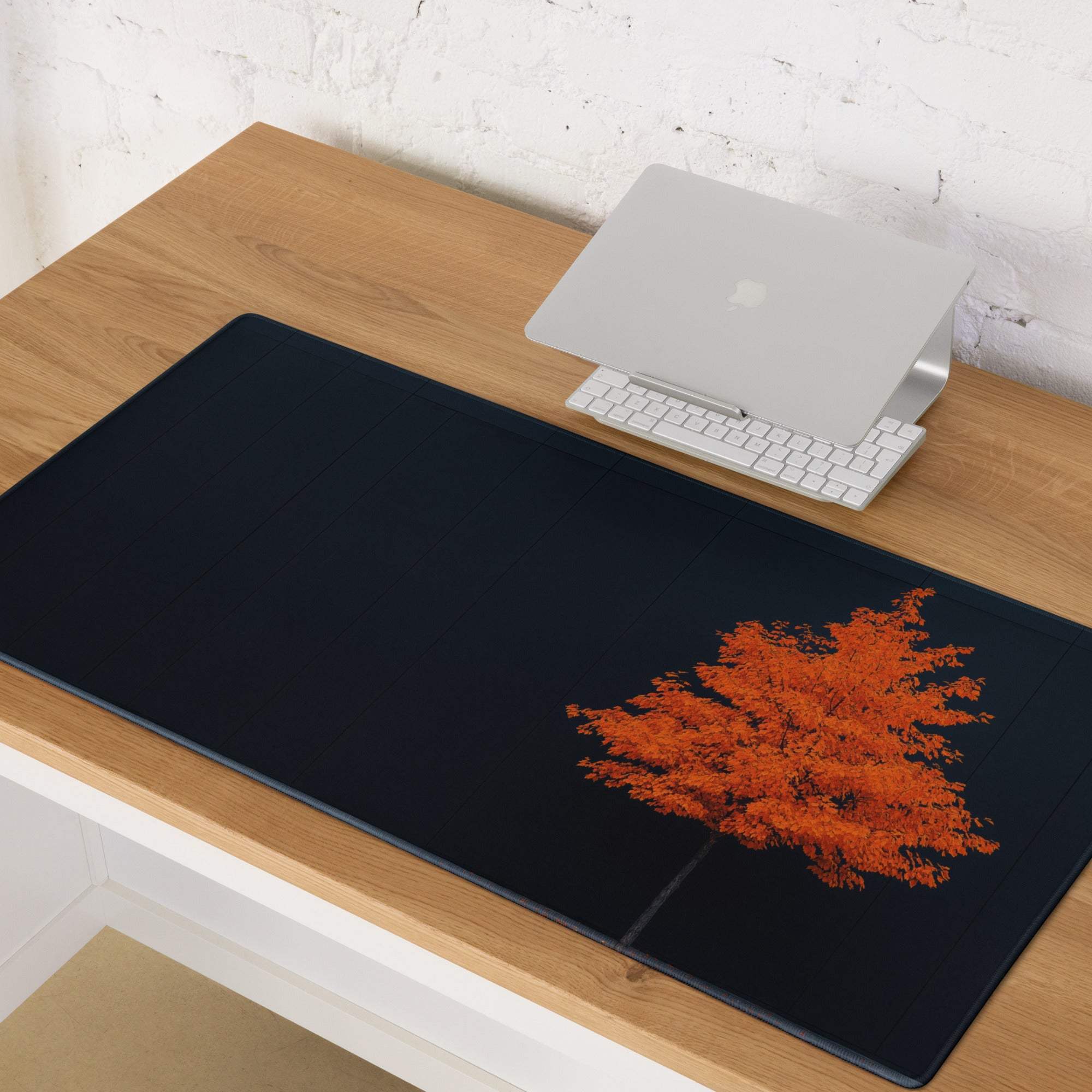 Black rectangular mousepad with vibrant orange tree on dark backdrop