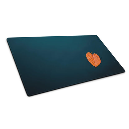 Dark teal cutting board with orange leaf on professional deep ocean blue mouse pad